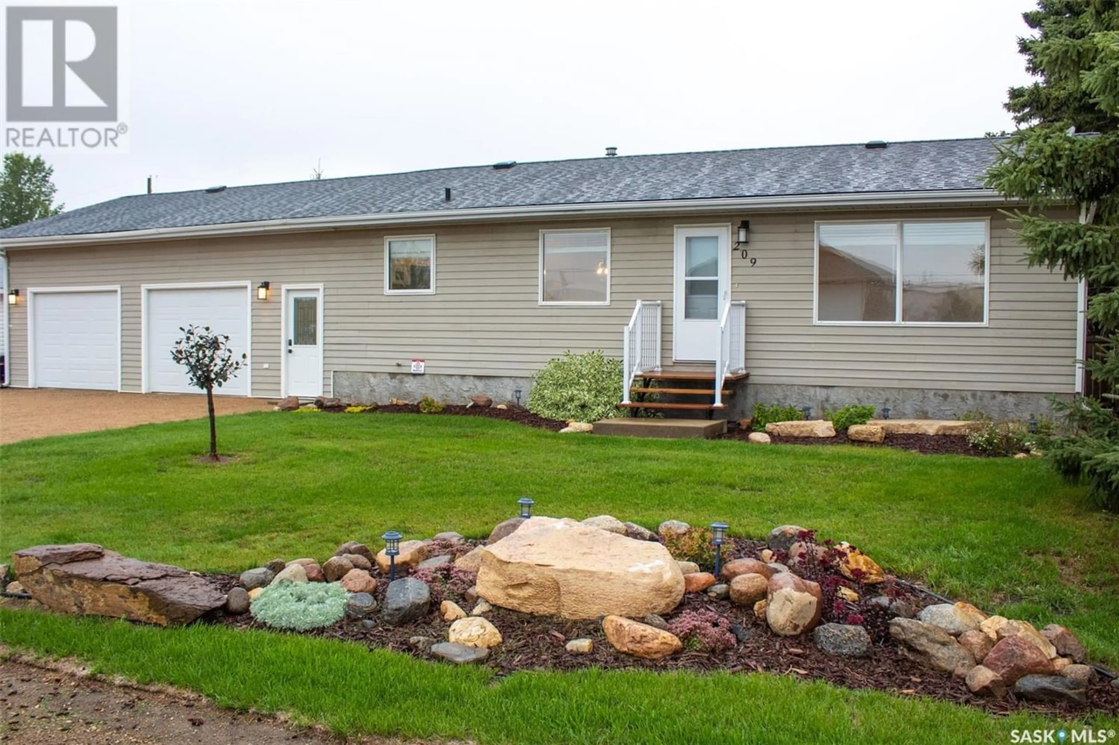 Home with vinyl exterior material for 209 4th AVENUE S, St. Brieux Saskatchewan S0K3V0