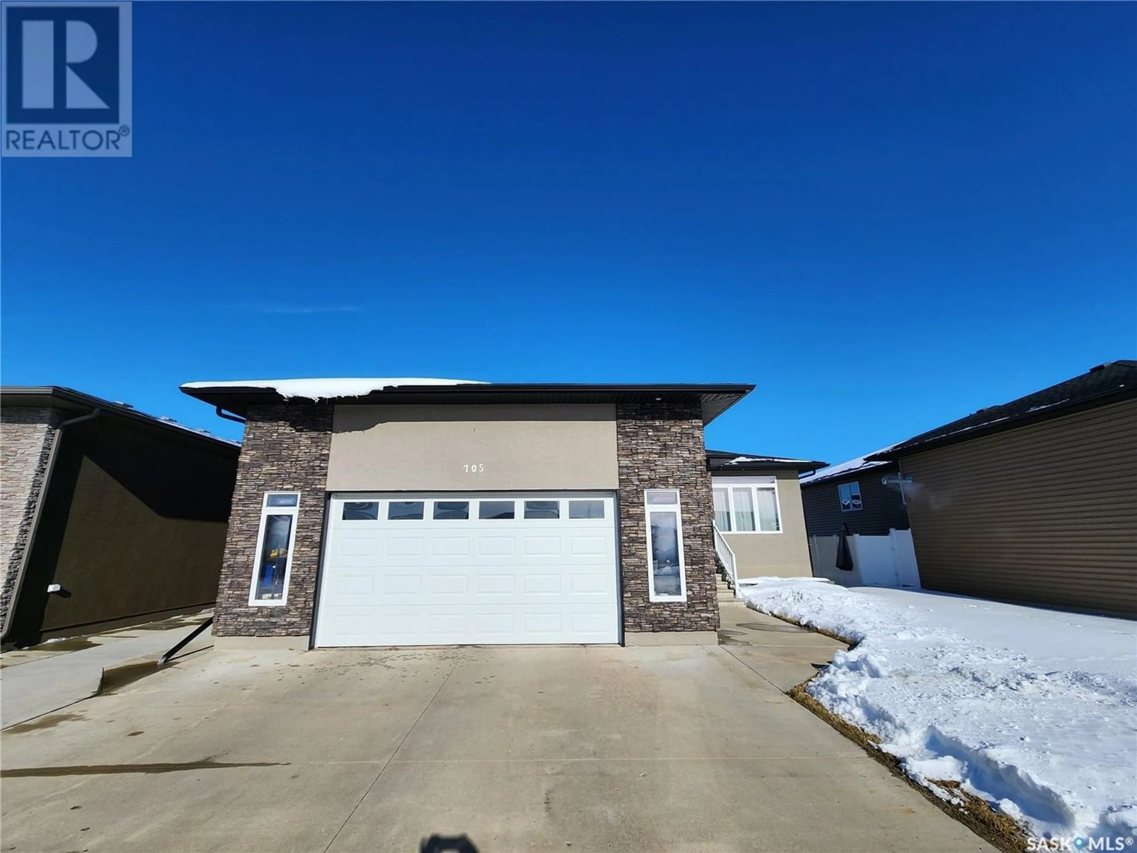 Frontside or backside of a home for 705 BARBER CRESCENT, Weyburn Saskatchewan S4H0B9