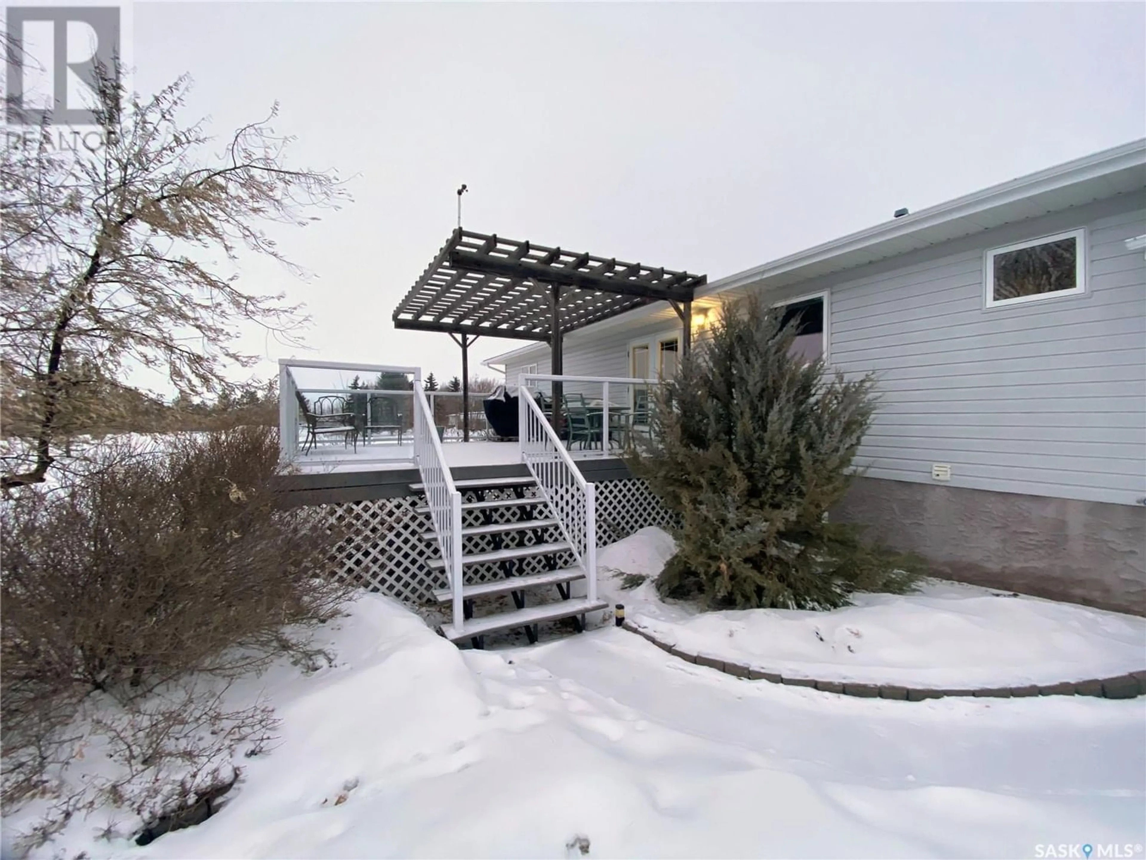 A pic from exterior of the house or condo, the fenced backyard for 800 McKenzie STREET N, Outlook Saskatchewan S0L2N0