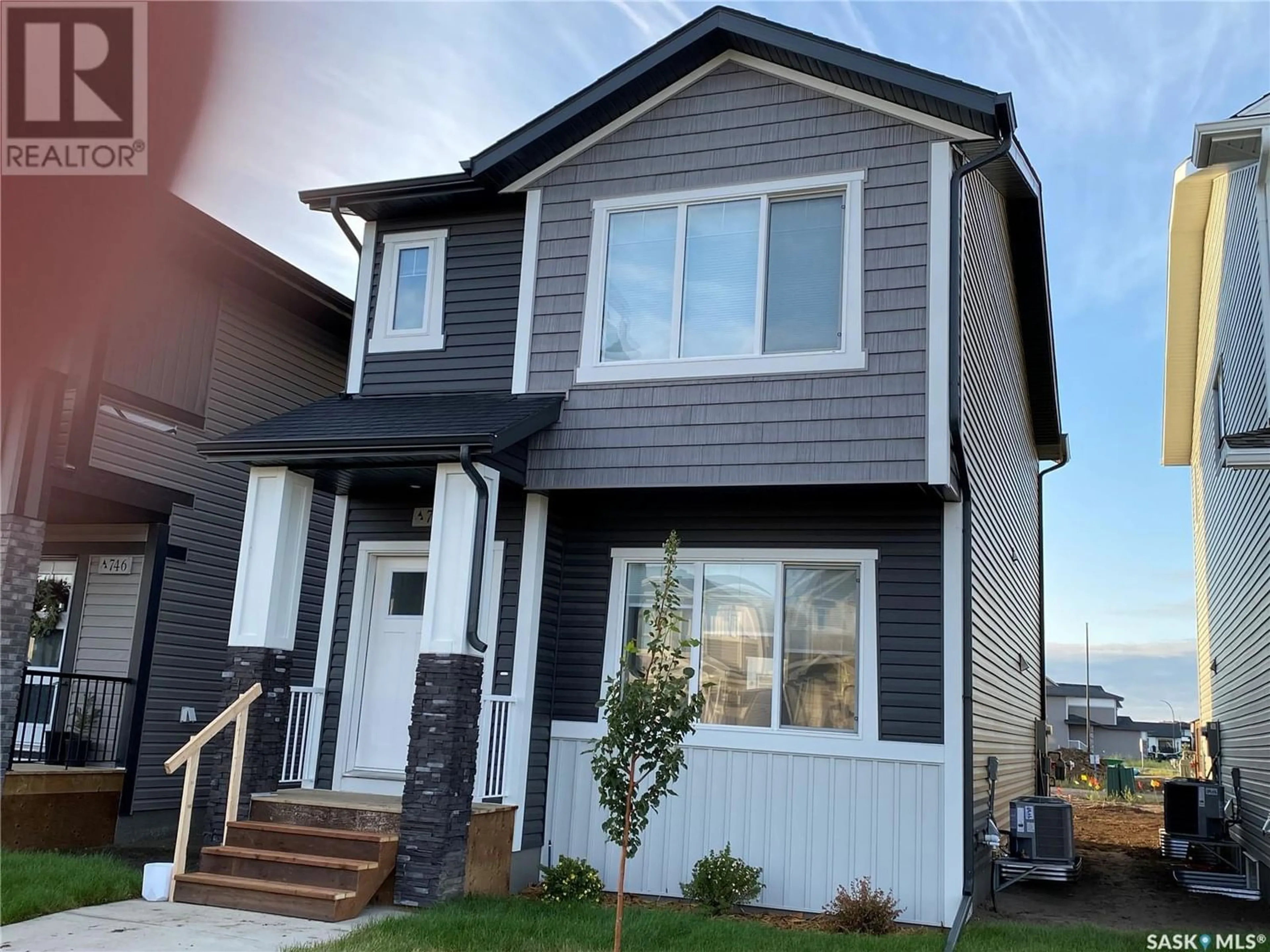 Home with vinyl exterior material for 1075 Brighton GATE, Saskatoon Saskatchewan S7V1S5
