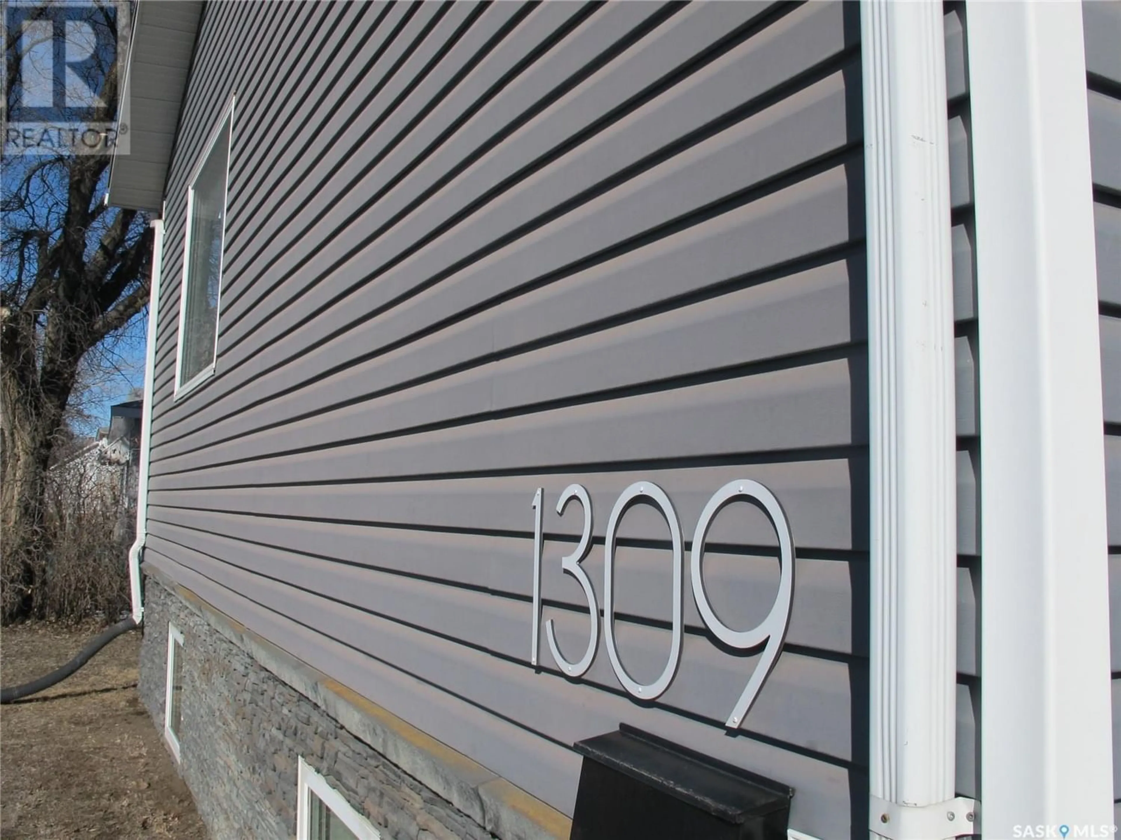 Home with vinyl exterior material for 1309 7TH STREET, Estevan Saskatchewan S4A1H1