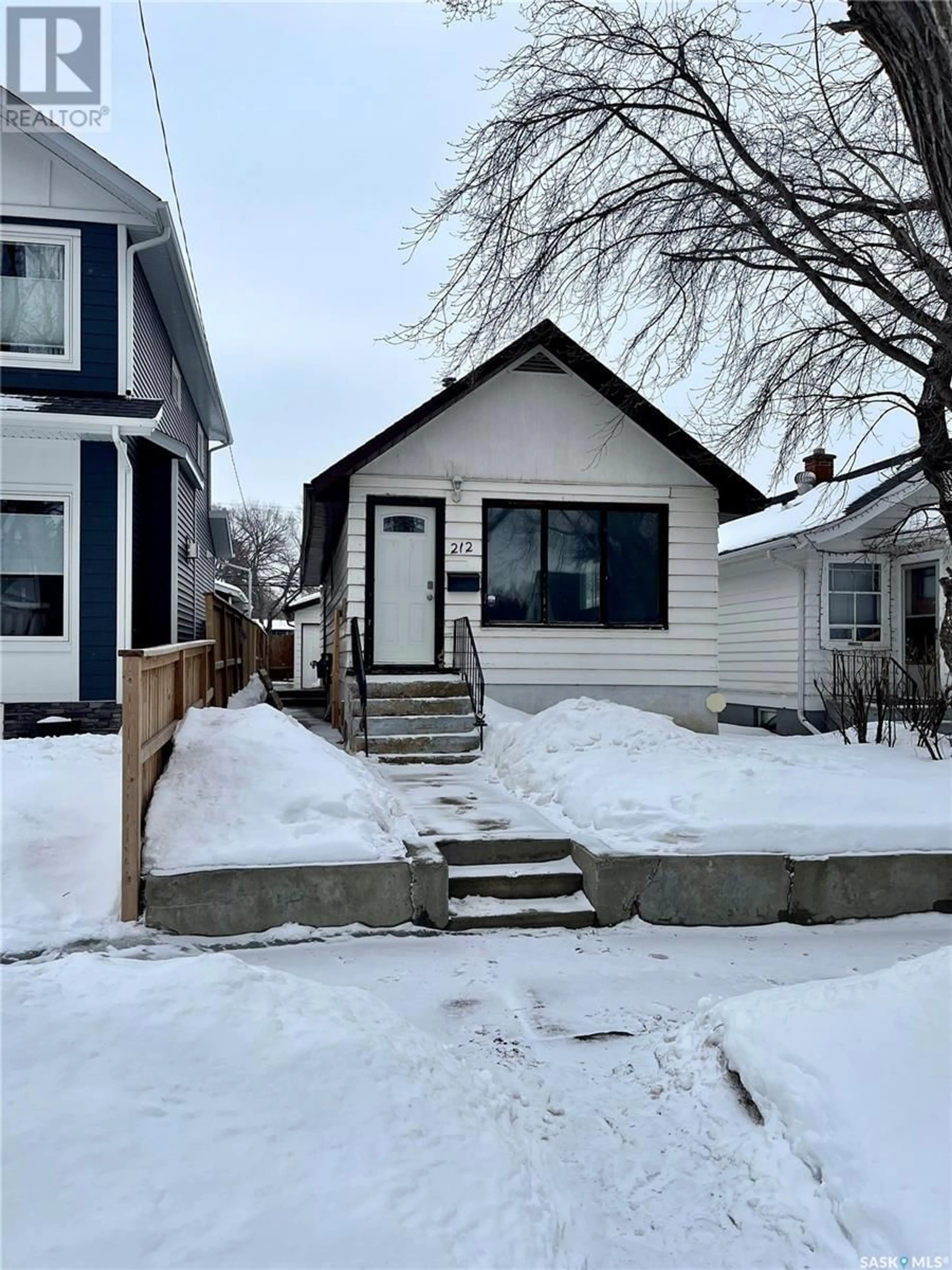 Frontside or backside of a home for 212 1st STREET E, Saskatoon Saskatchewan S7H1R9