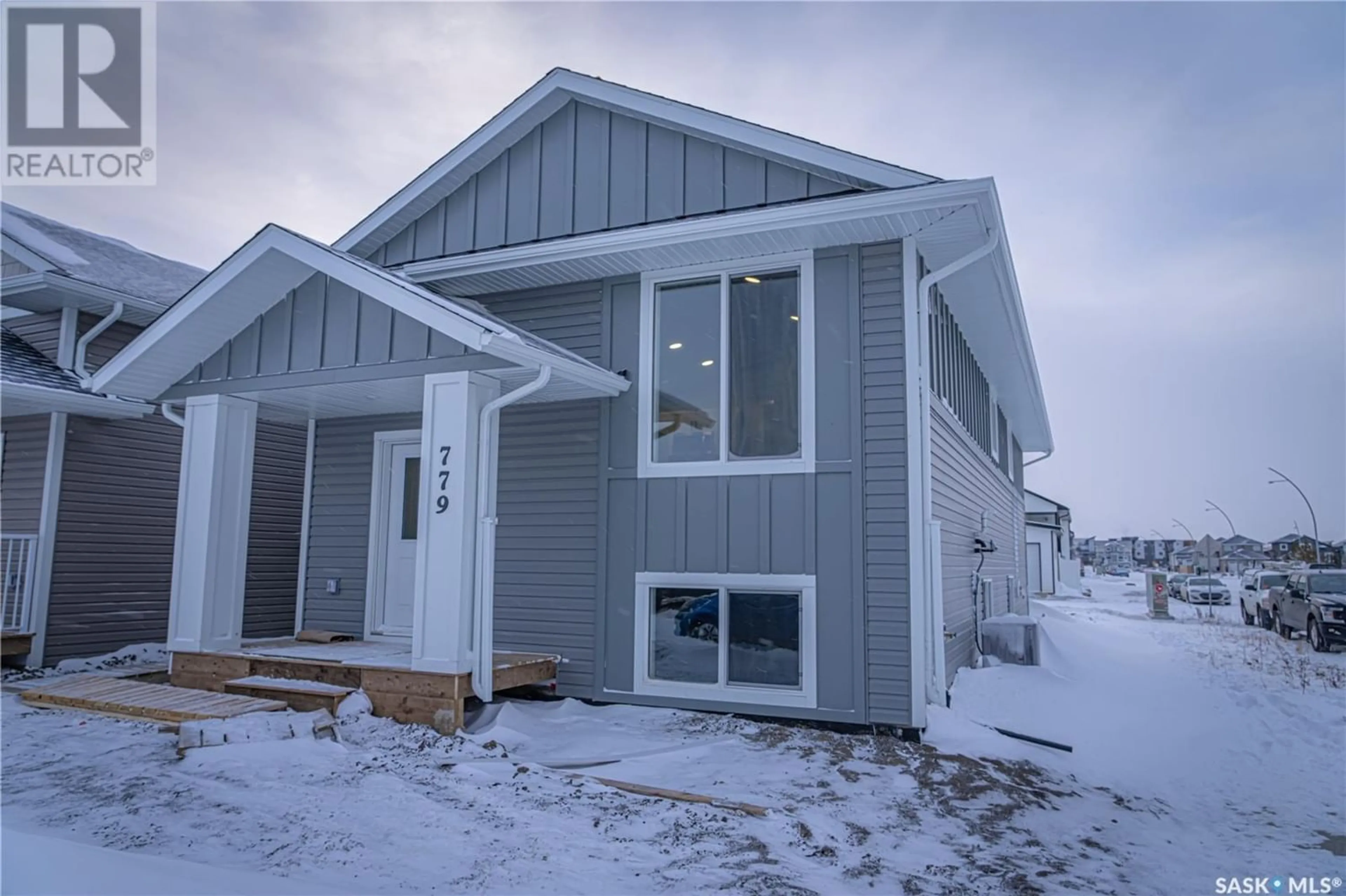 A pic from exterior of the house or condo for 407 Bolstad LINK, Saskatoon Saskatchewan S7W0C2