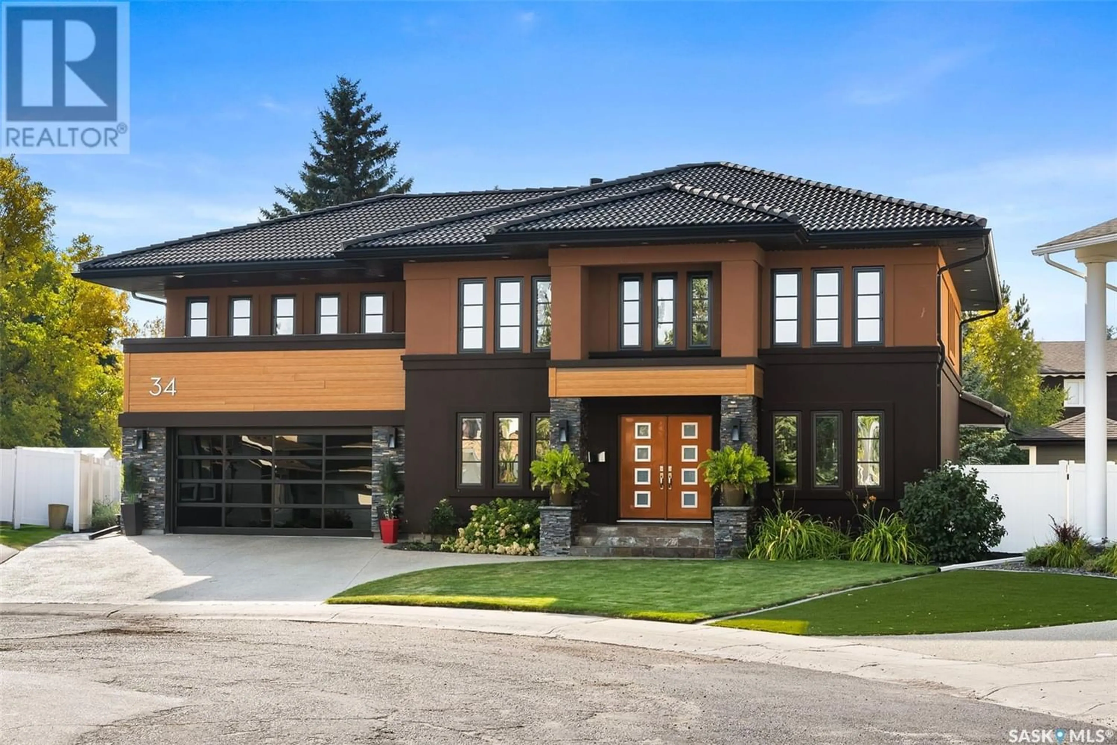 Home with brick exterior material for 34 LESLIE PLACE, Regina Saskatchewan S4S6R2