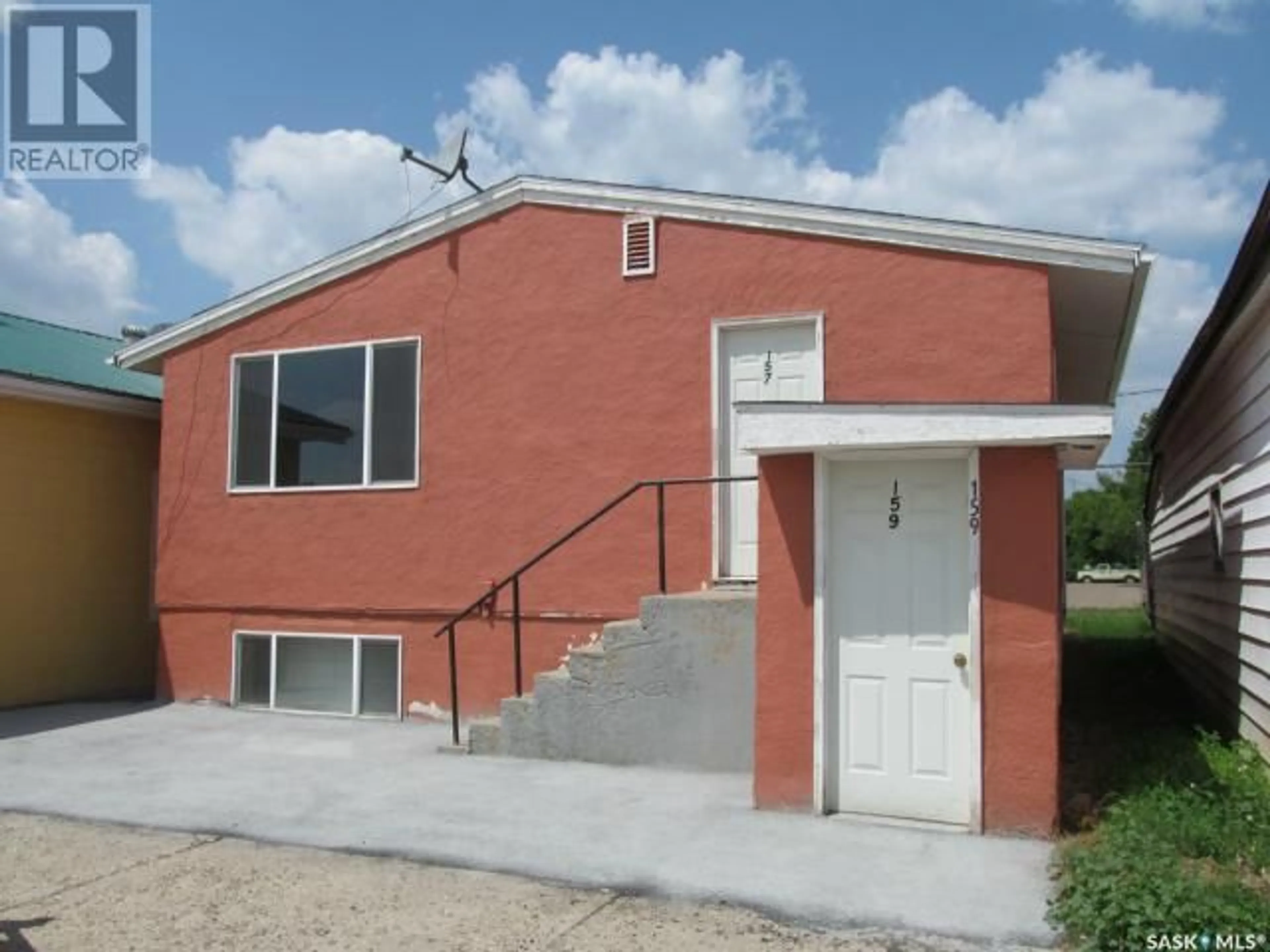 Frontside or backside of a home for 157 159 16 3rd AVENUE E, Shaunavon Saskatchewan S0N2M0