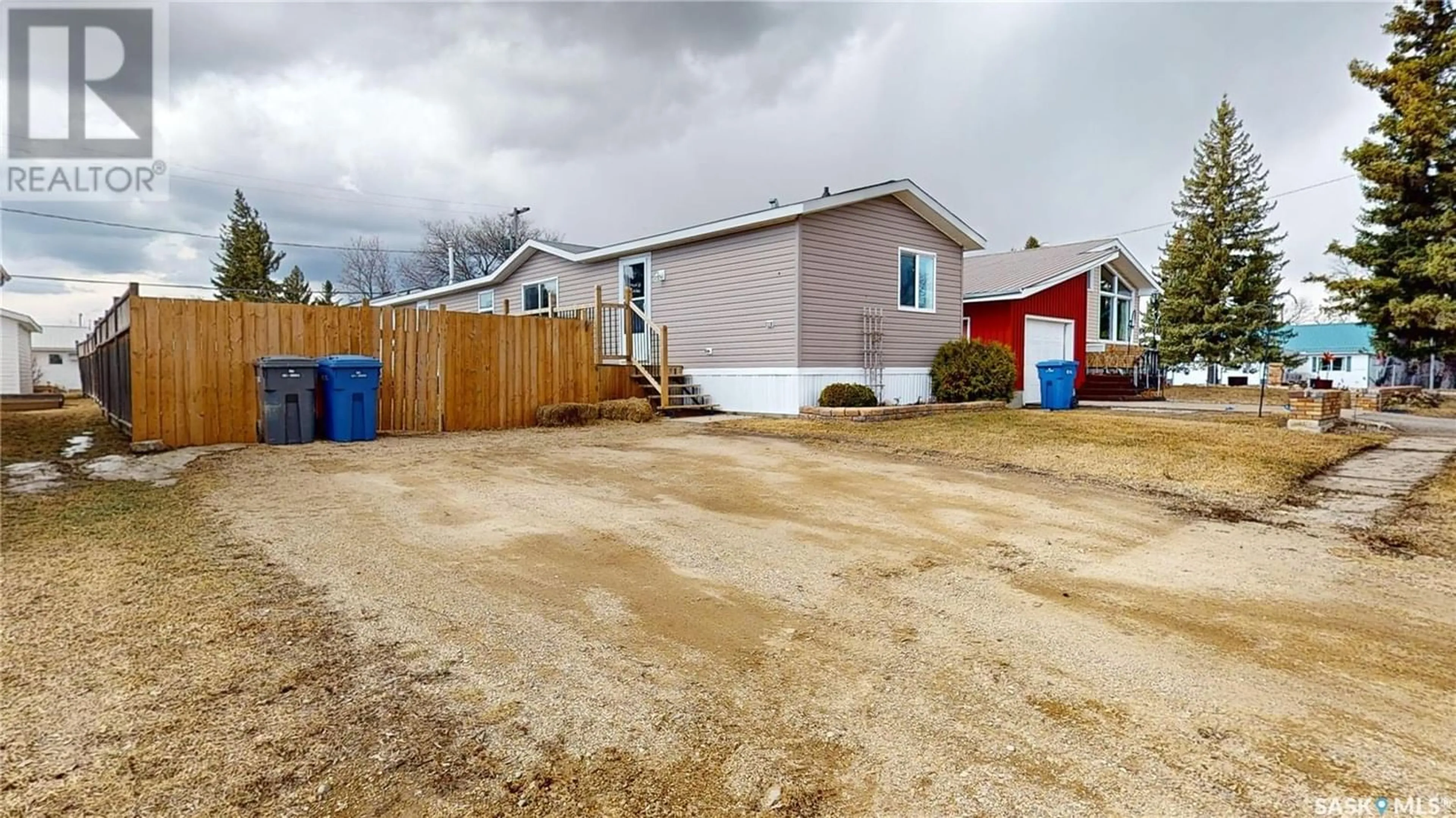 Frontside or backside of a home, the fenced backyard for 212 Main STREET, Wawota Saskatchewan S0G5A0