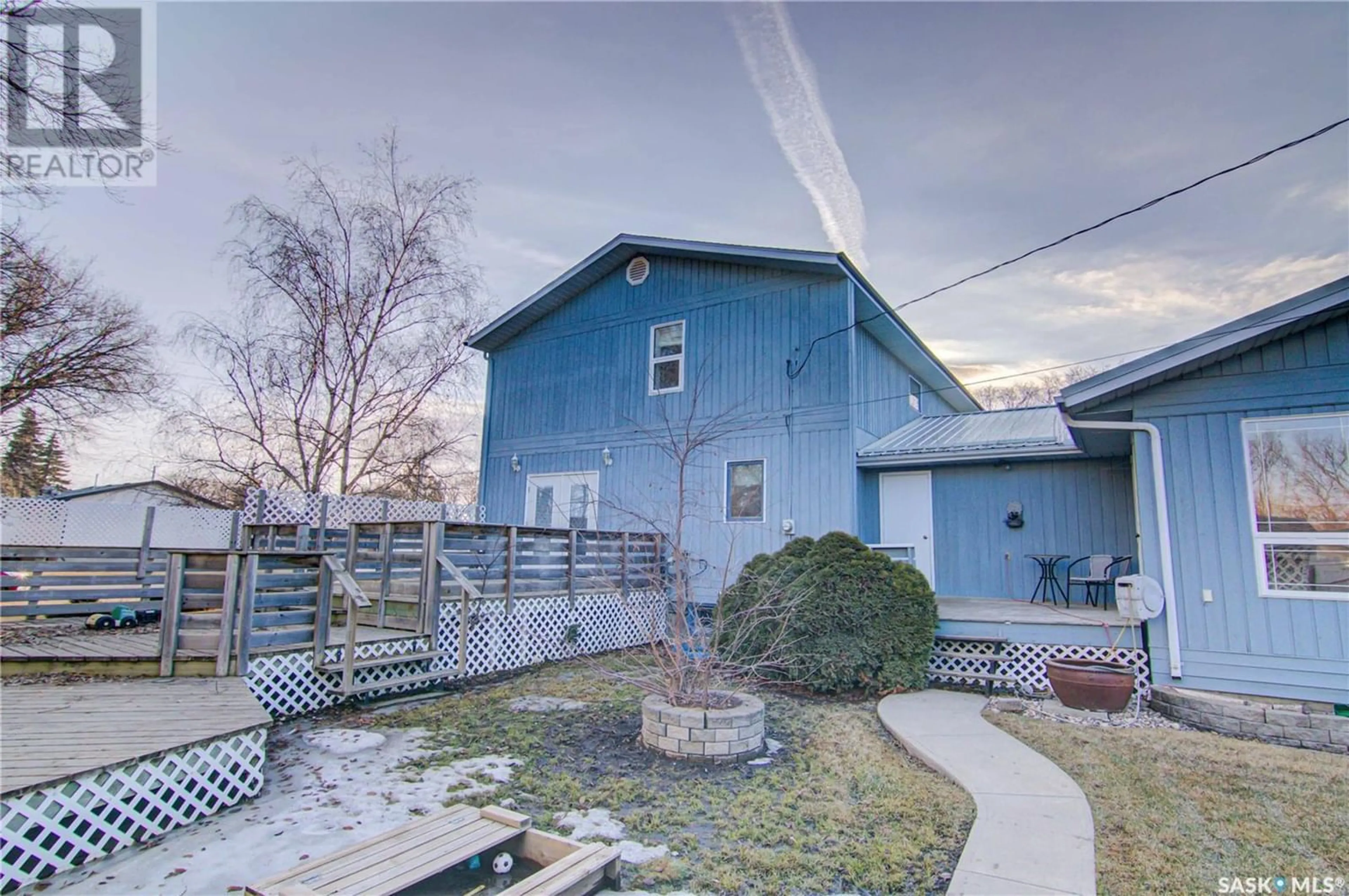 A pic from exterior of the house or condo, the fenced backyard for 302 McLeod AVENUE E, Melfort Saskatchewan S0E1A0