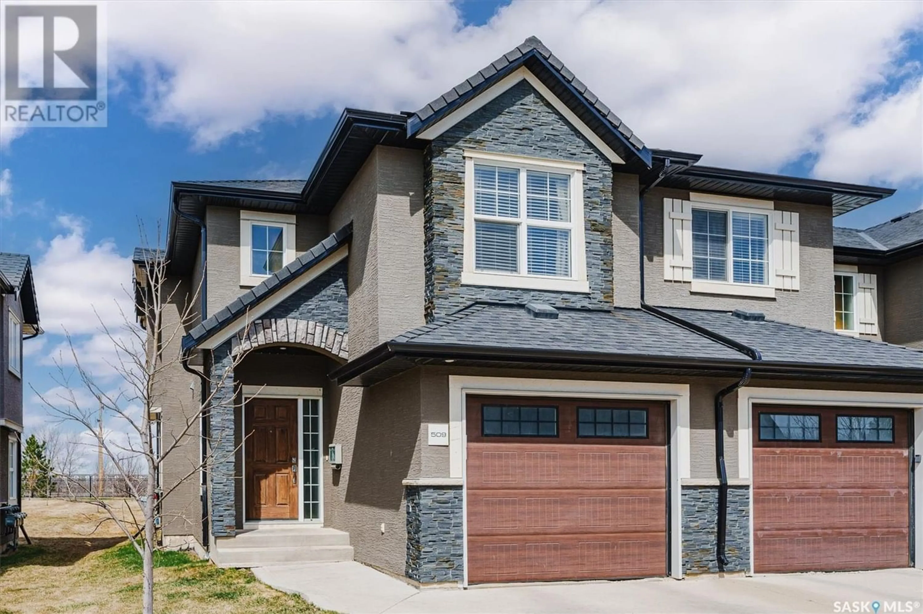 Home with brick exterior material for 509 1303 Paton CRESCENT, Saskatoon Saskatchewan S7W0P7