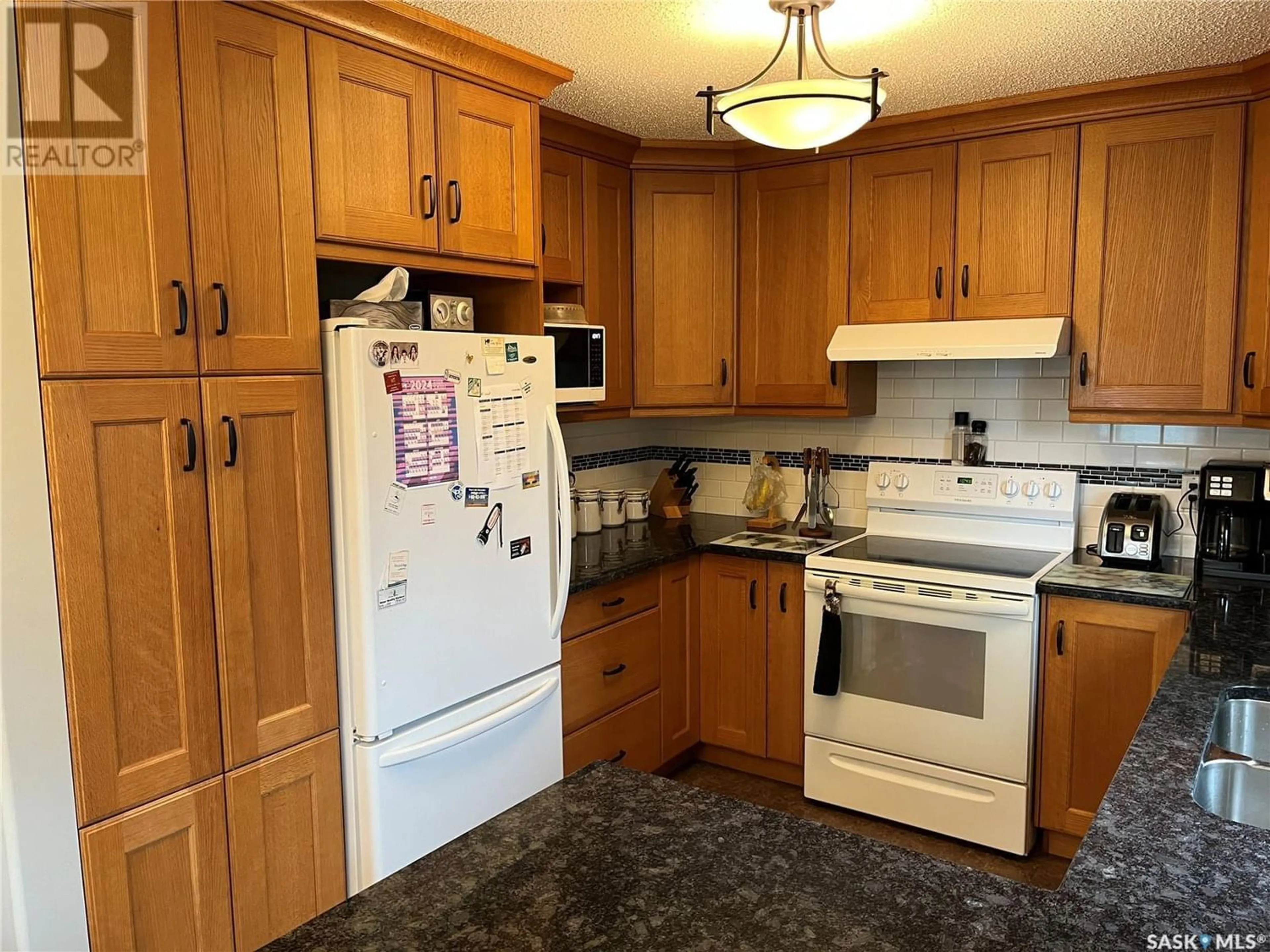 Standard kitchen, wood floors, cottage for 423 Qu'Appelle STREET, Weyburn Saskatchewan S4H0R3