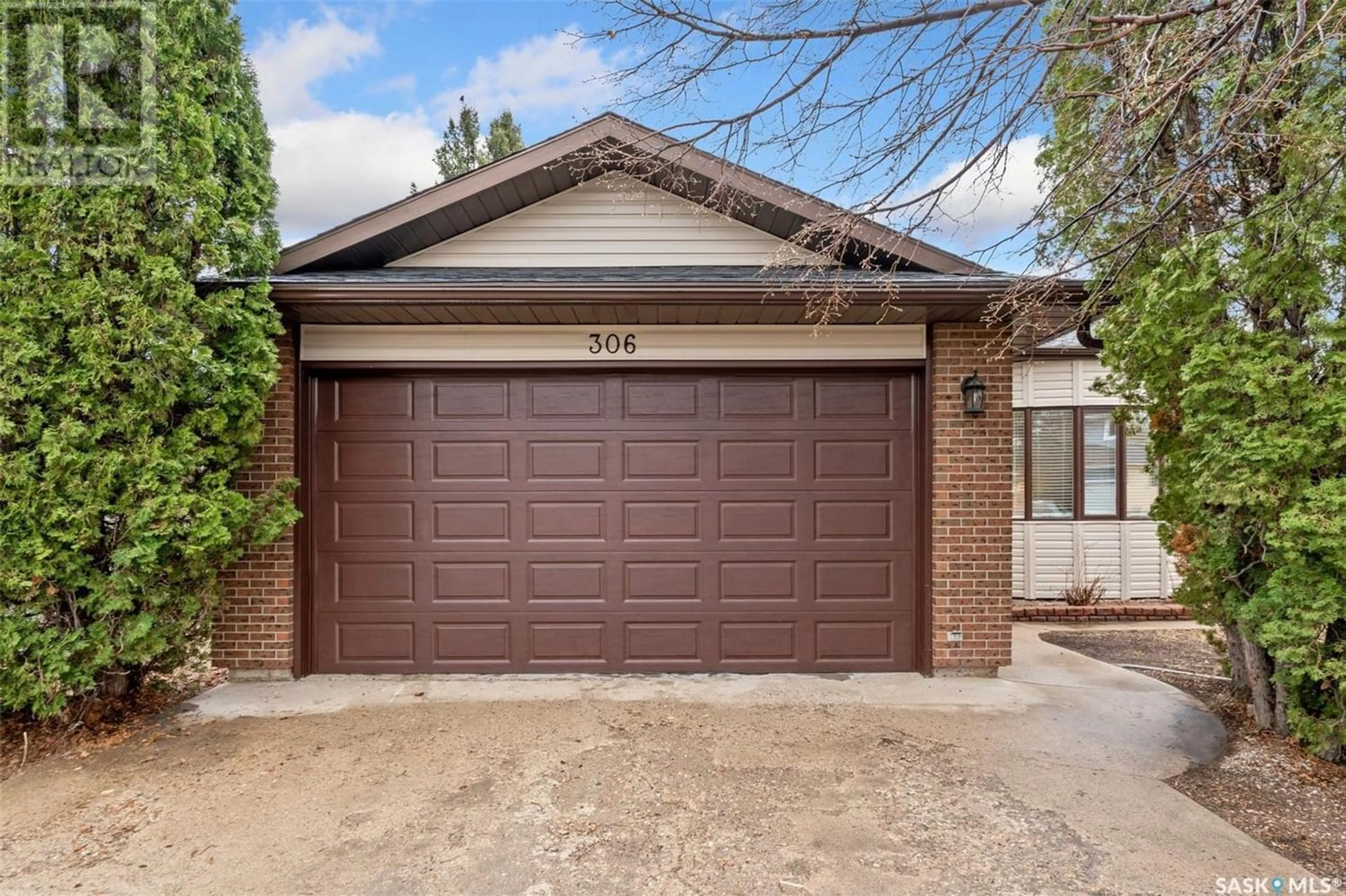 Home with brick exterior material for 306 AE Adams LANE, Saskatoon Saskatchewan S7H5N4