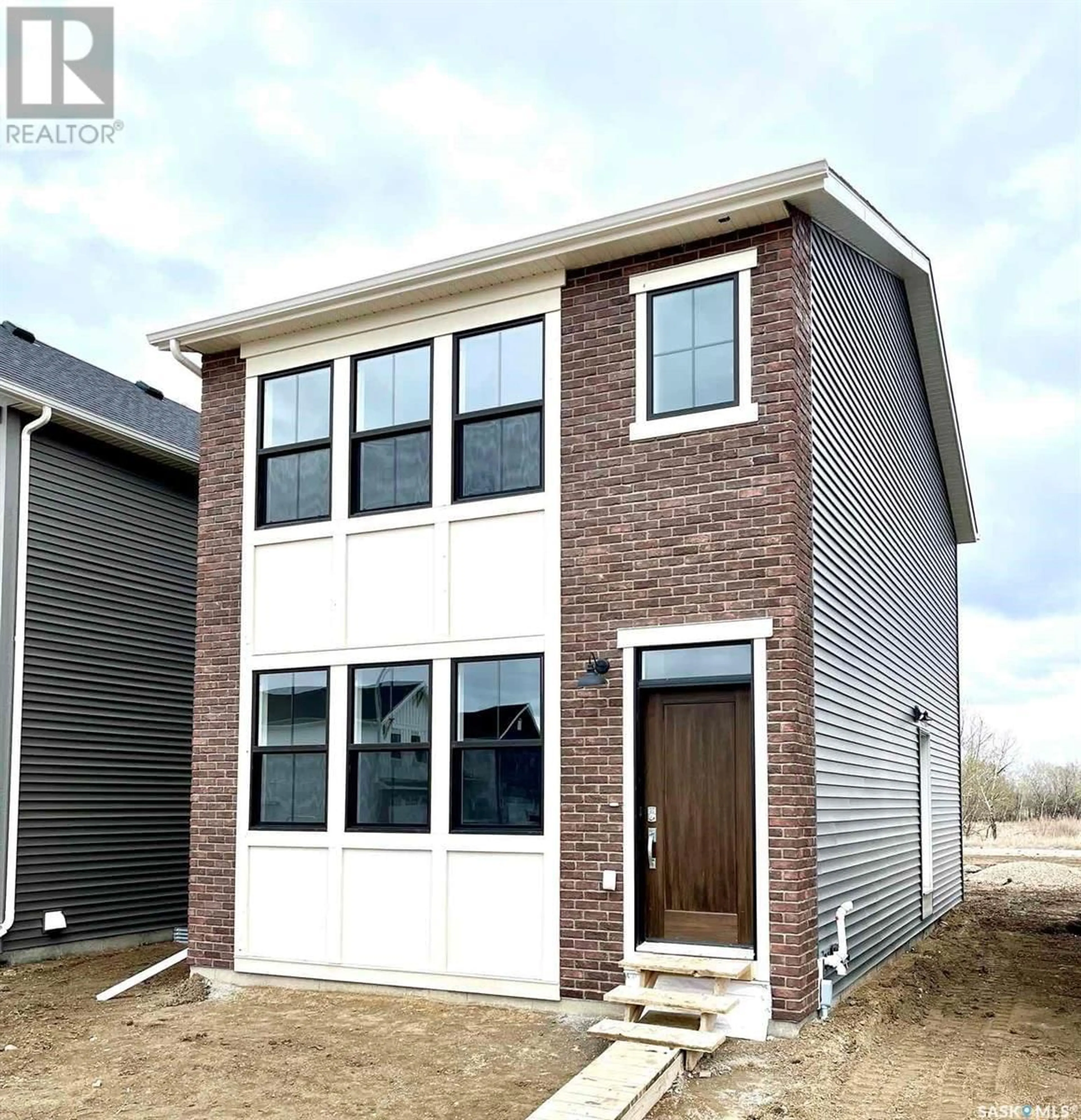 Home with brick exterior material for 739 Henry Dayday ROAD, Saskatoon Saskatchewan S7W1H5