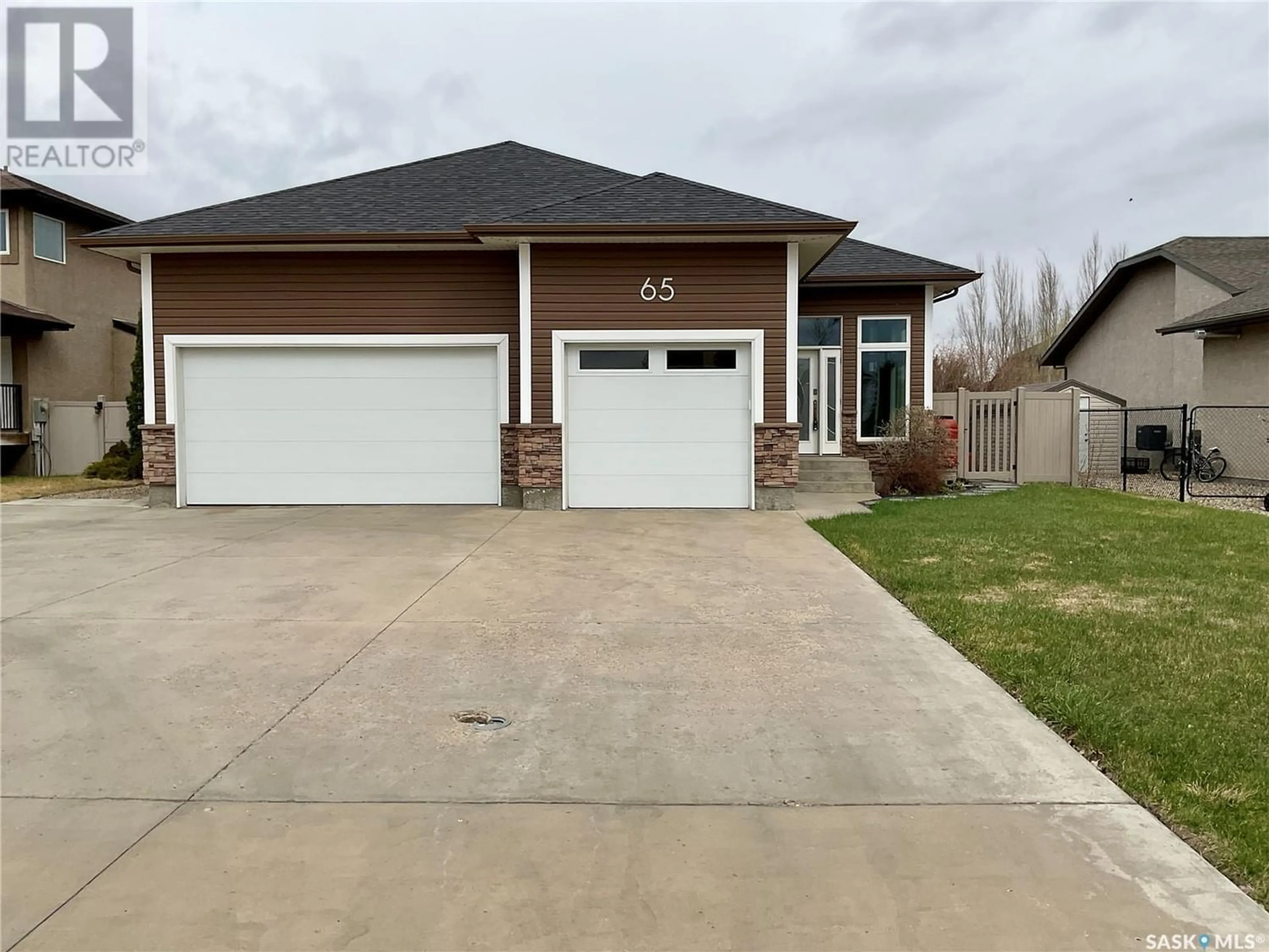 Frontside or backside of a home for 65 Fairway CRESCENT, White City Saskatchewan S4L0A5