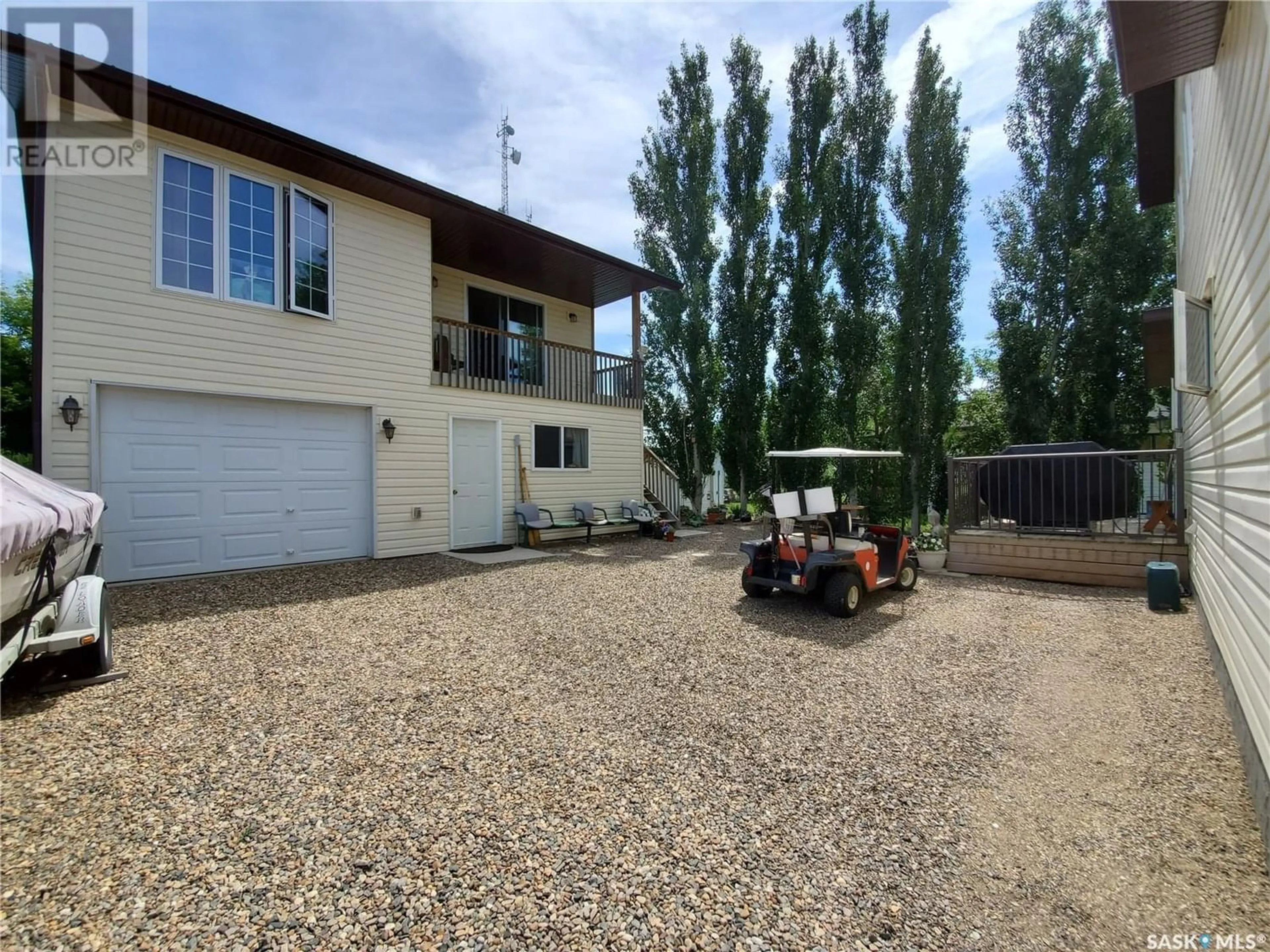 Frontside or backside of a home, the fenced backyard for 325 Ruby DRIVE, Hitchcock Bay Saskatchewan S0L0G0