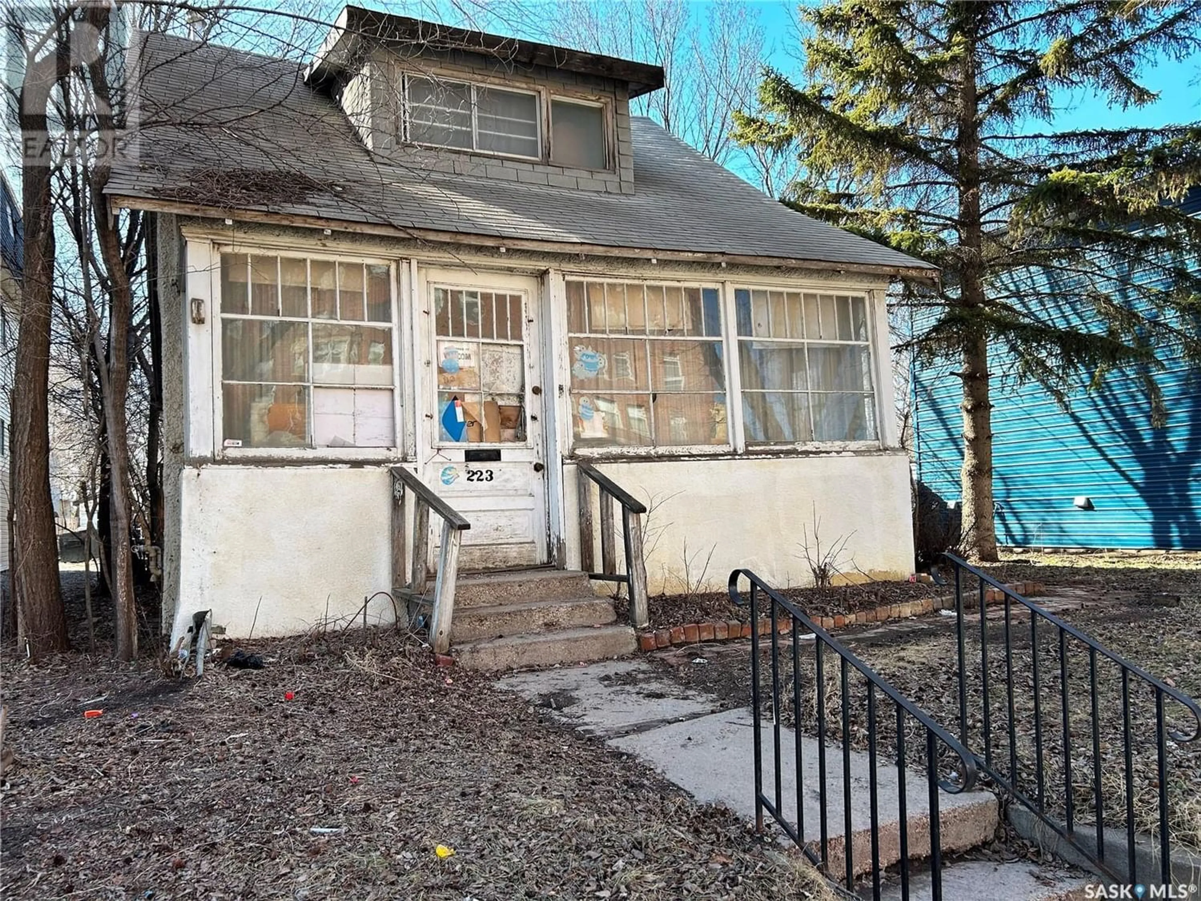 Frontside or backside of a home for 223 R AVENUE S, Saskatoon Saskatchewan S7M2Y9