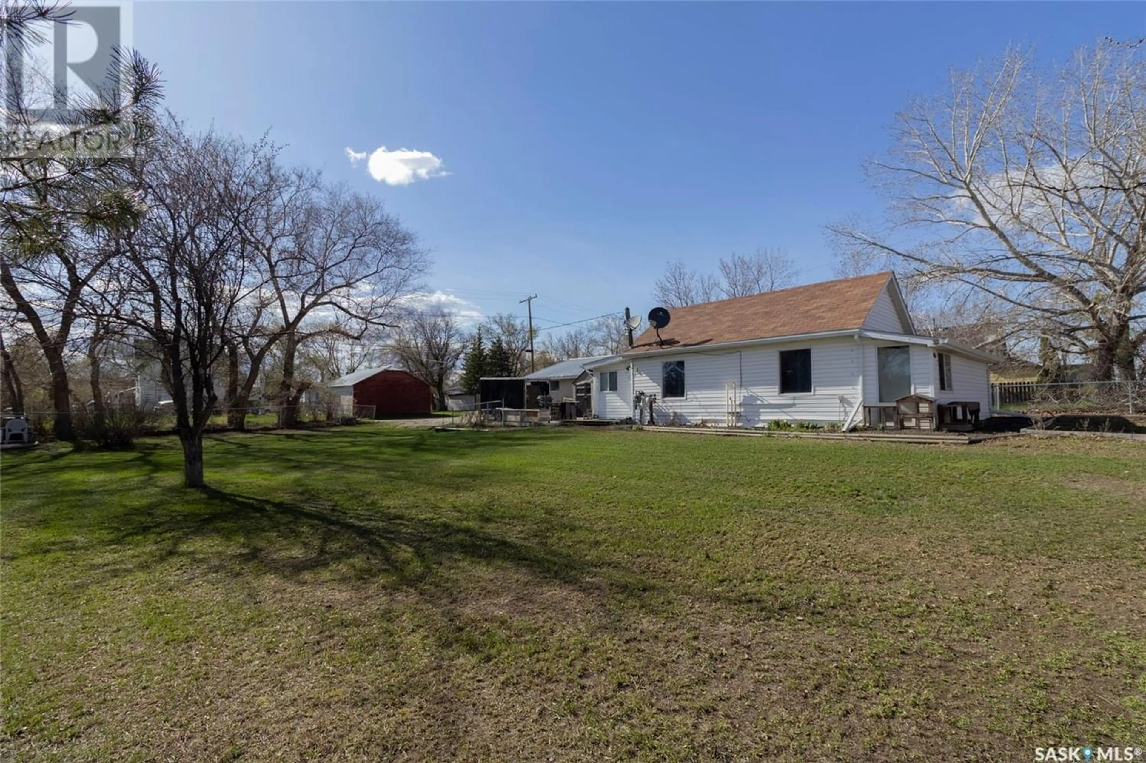 Frontside or backside of a home, the fenced backyard for 816 7th STREET, Perdue Saskatchewan S0K3C0