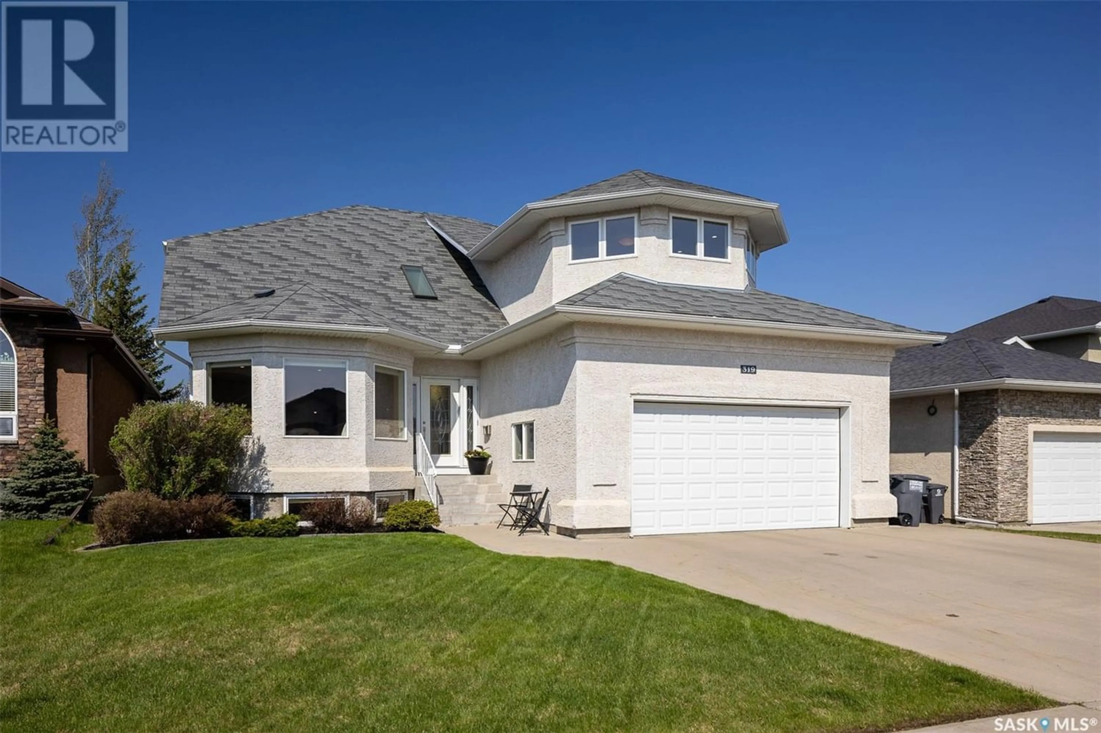 Frontside or backside of a home for 319 Thode AVENUE, Saskatoon Saskatchewan S7W1A1