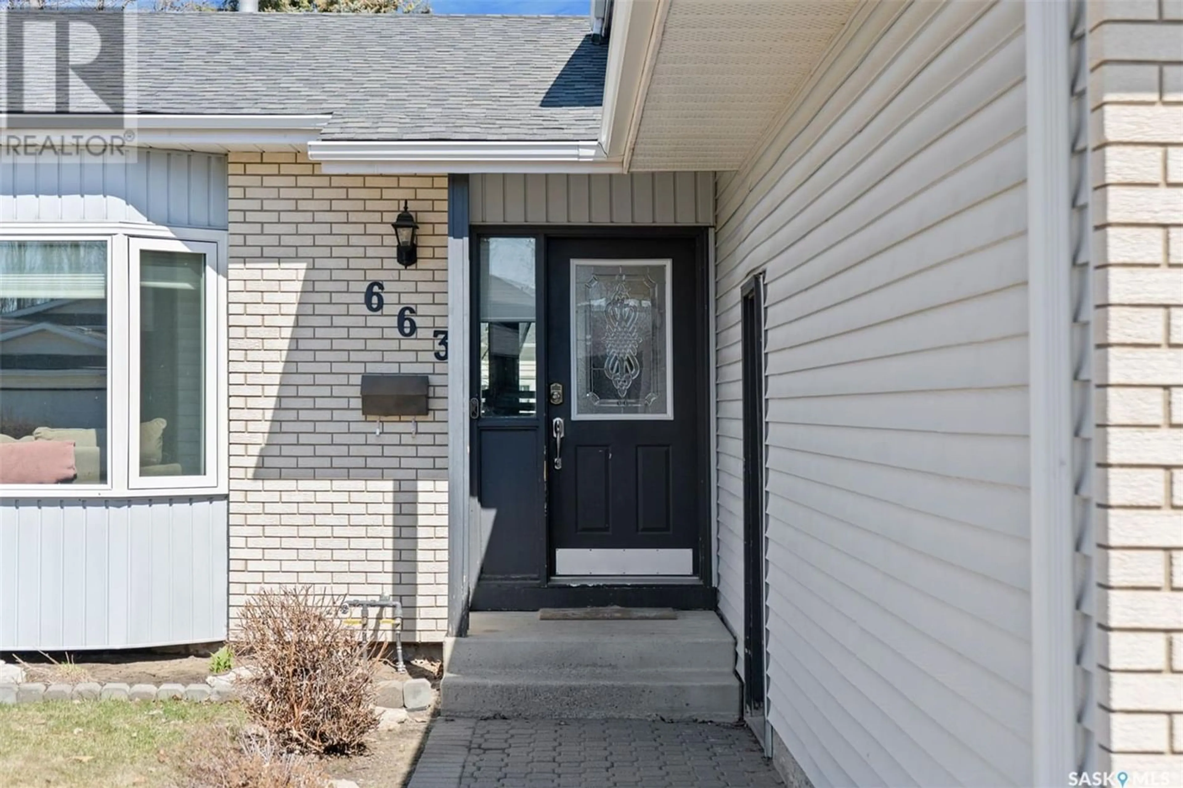 Home with brick exterior material for 663 Brightsand CRESCENT, Saskatoon Saskatchewan S7J4Y7