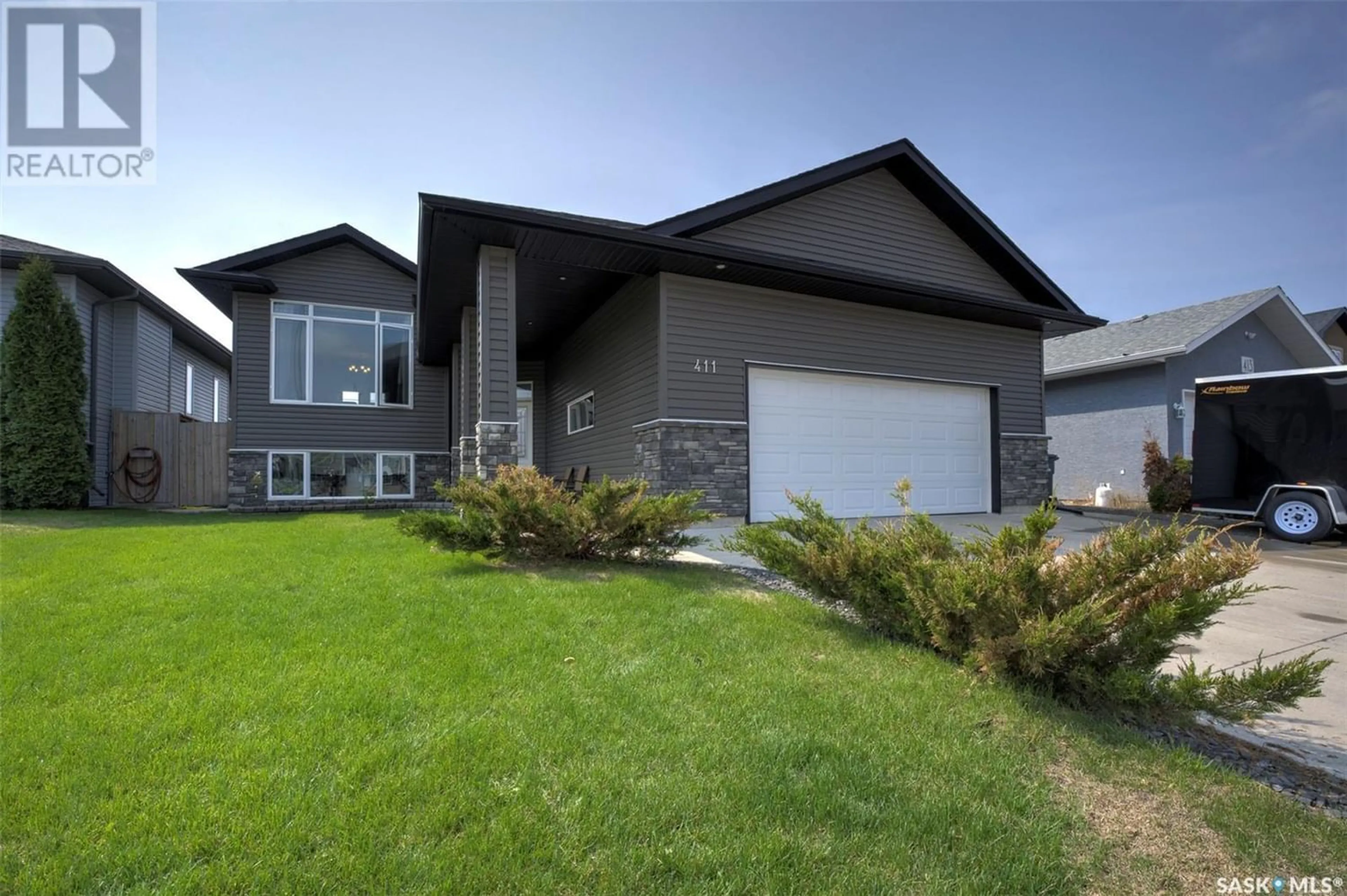 Frontside or backside of a home for 411 Clubhouse BOULEVARD W, Warman Saskatchewan S0K0A1