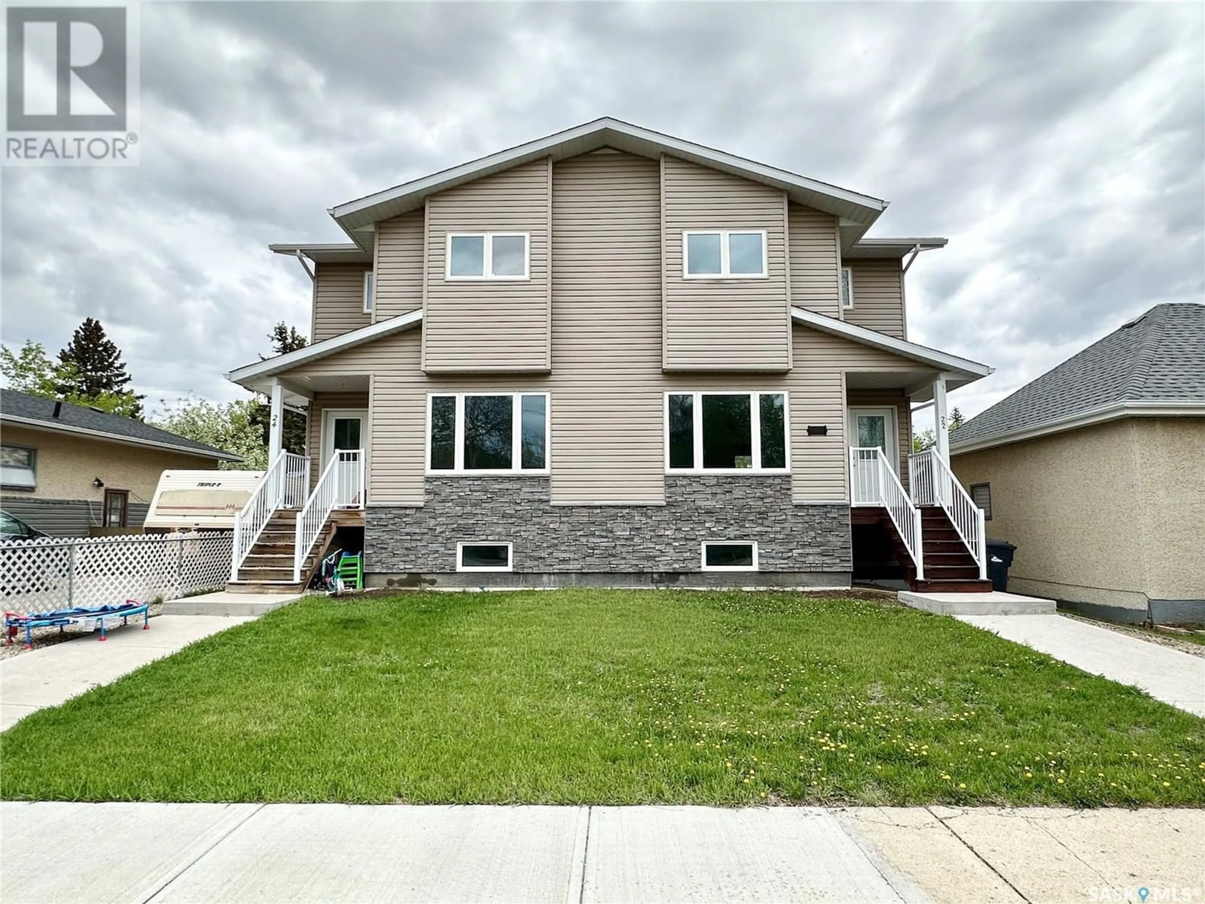 Frontside or backside of a home for 22 & 24 8th STREET NE, Weyburn Saskatchewan S4H1C7
