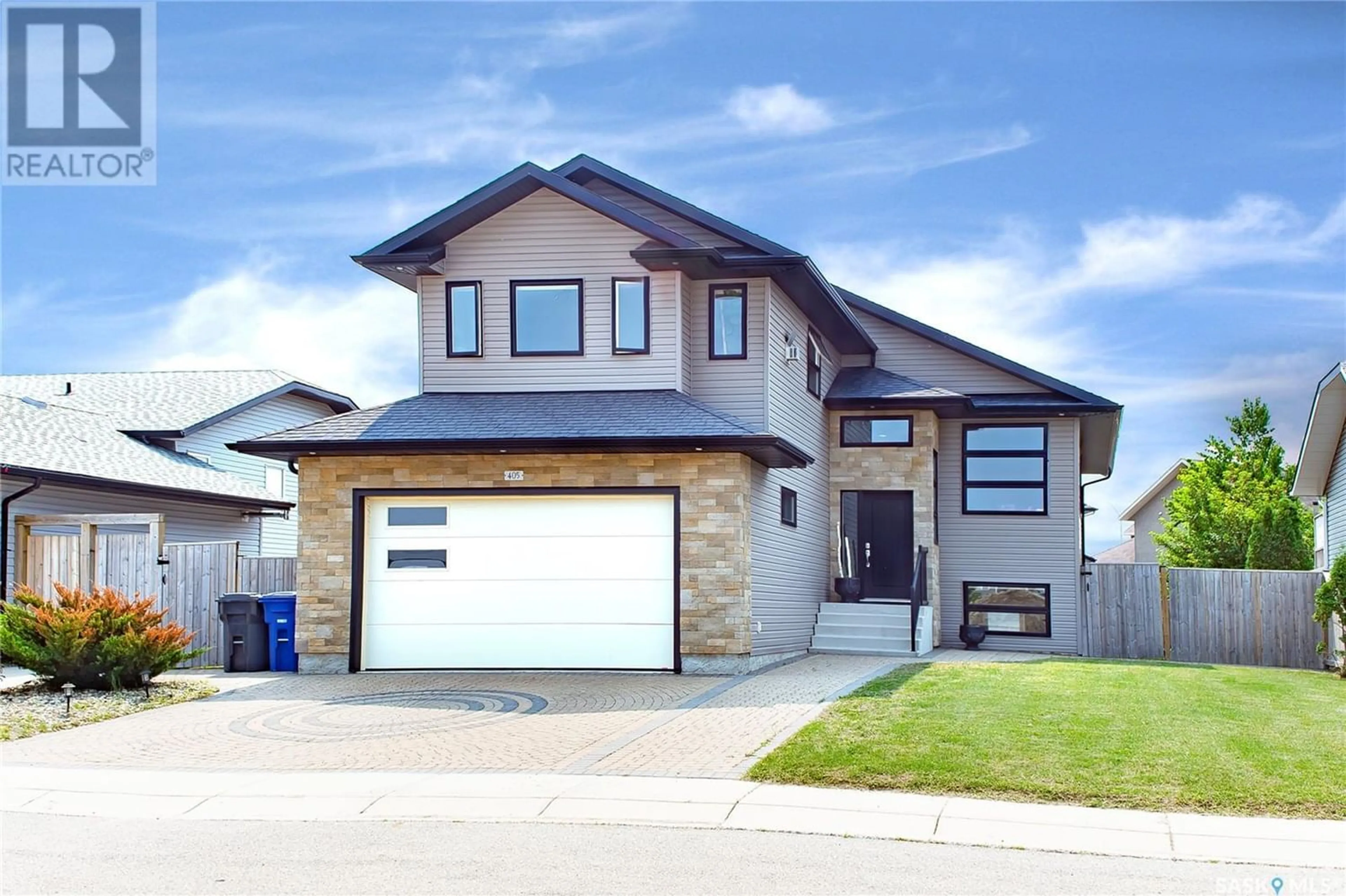 Frontside or backside of a home for 405 Clubhouse BOULEVARD W, Warman Saskatchewan S0K4S2