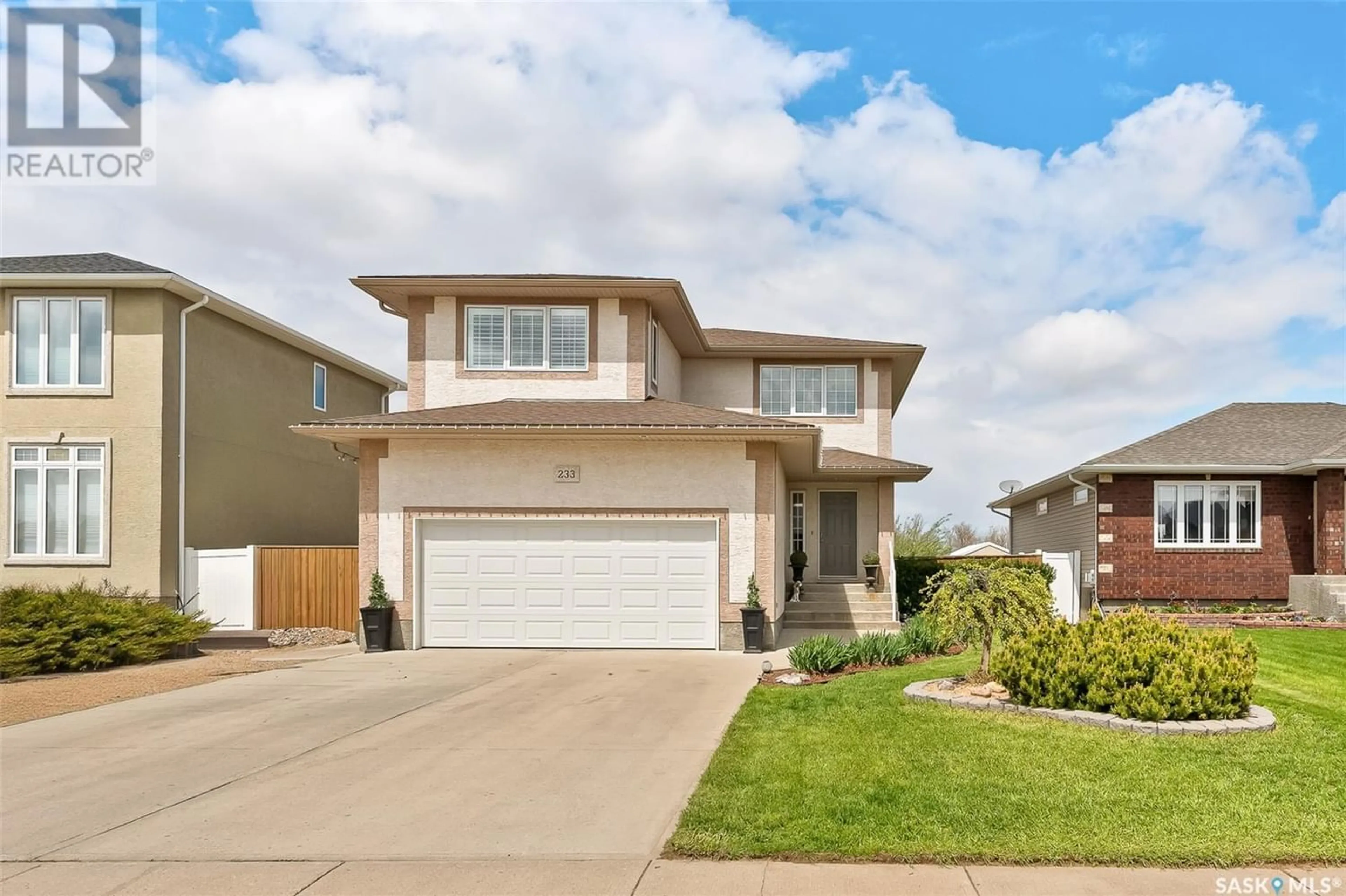 Frontside or backside of a home for 233 Wood Lily DRIVE, Moose Jaw Saskatchewan S6J0A3
