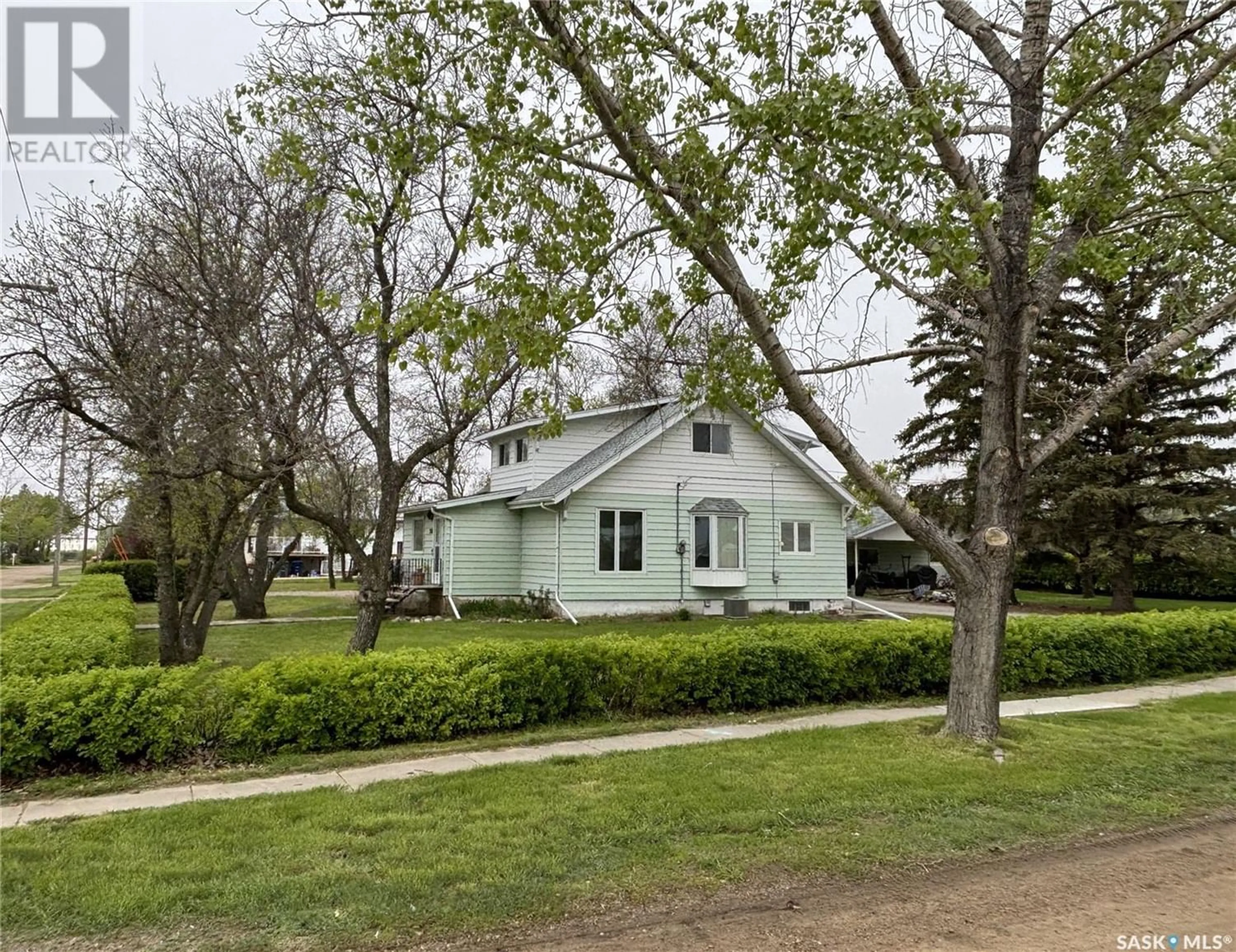 A pic from outside/outdoor area/front of a property/back of a property/a pic from drone, street for 200 1st STREET W, Dinsmore Saskatchewan S0L0T0