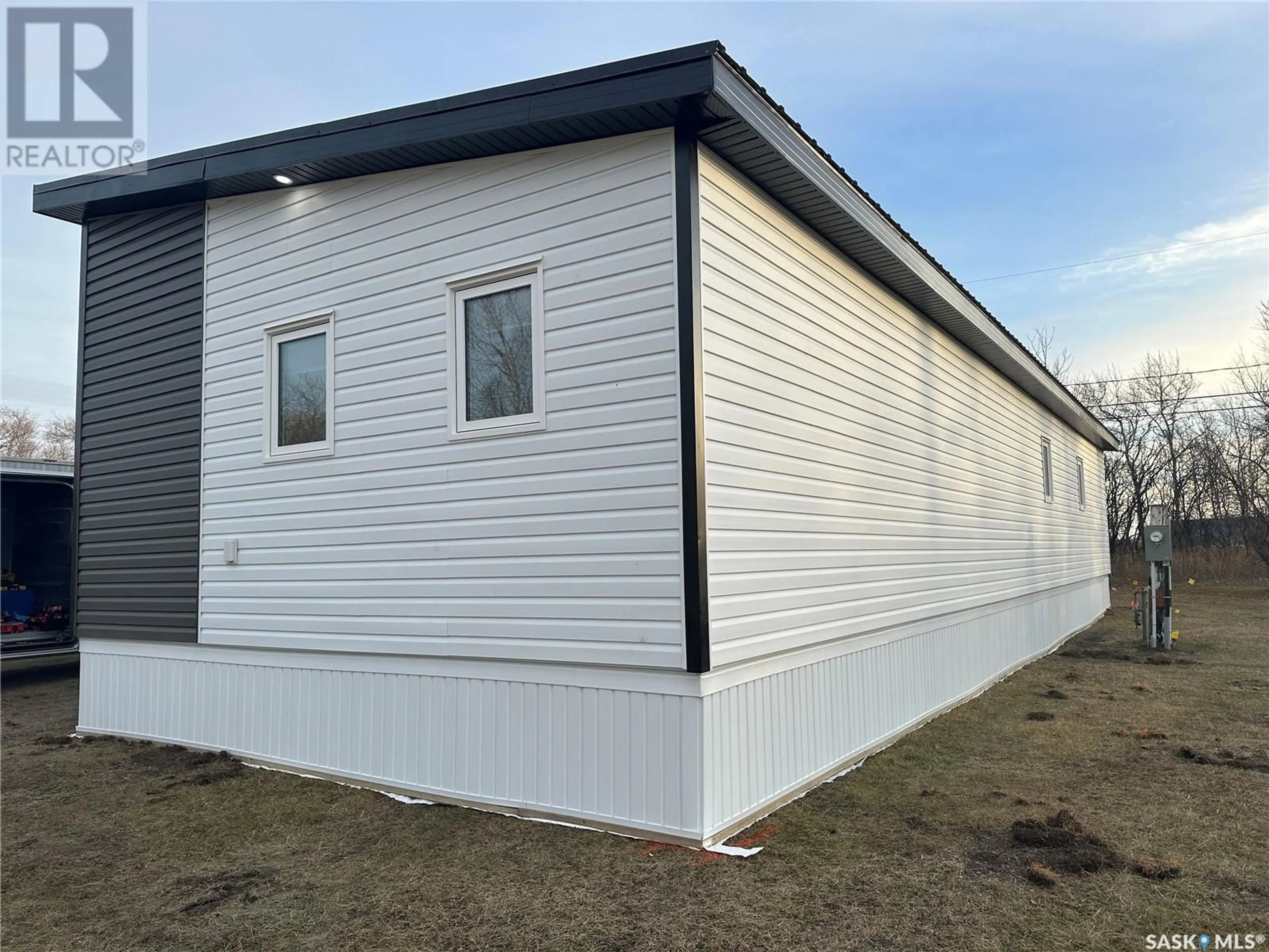 Home with vinyl exterior material for 8 Triland Trailer COURT, Lanigan Saskatchewan S0K2M0