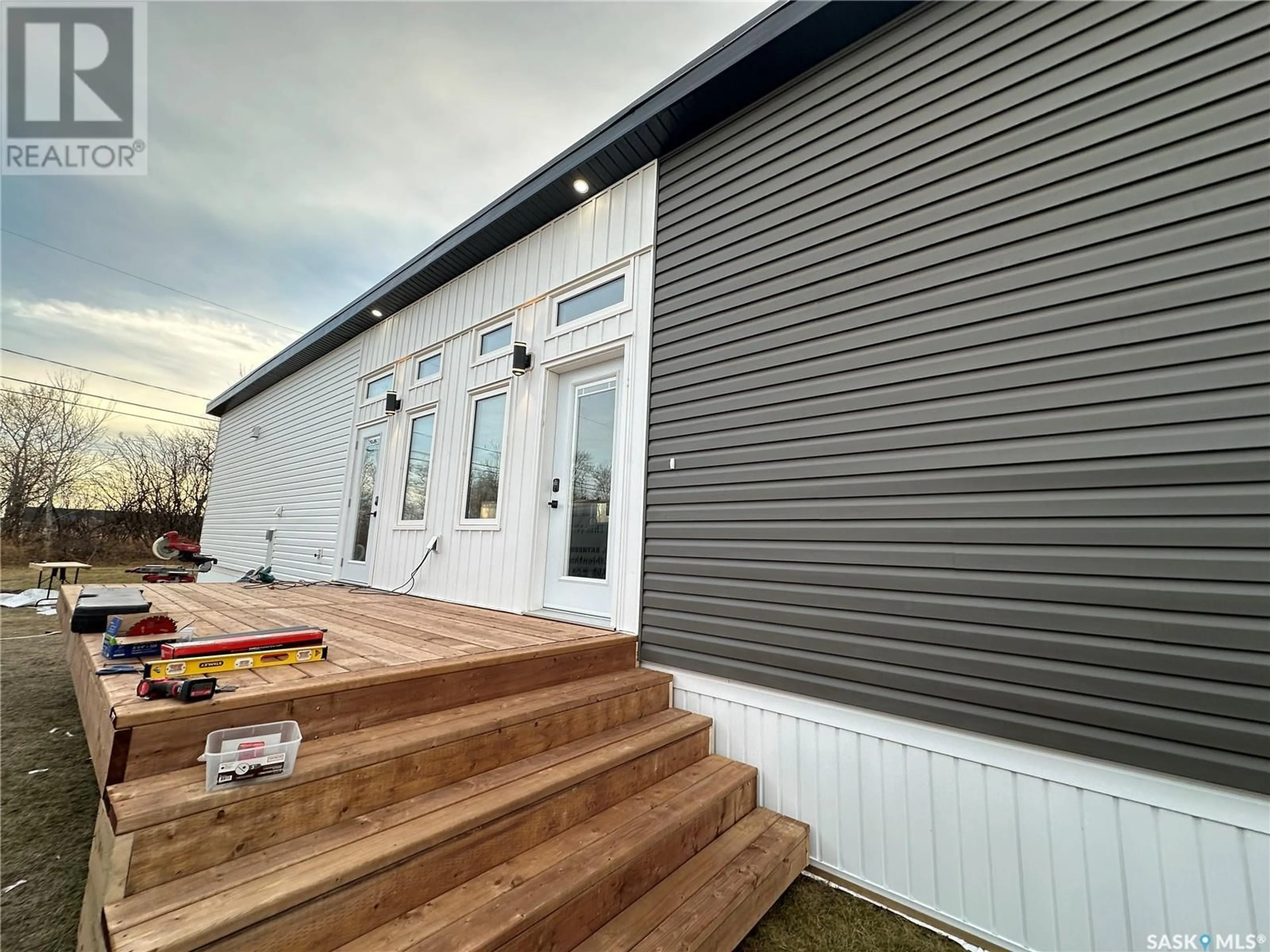 Home with vinyl exterior material for 8 Triland Trailer COURT, Lanigan Saskatchewan S0K2M0