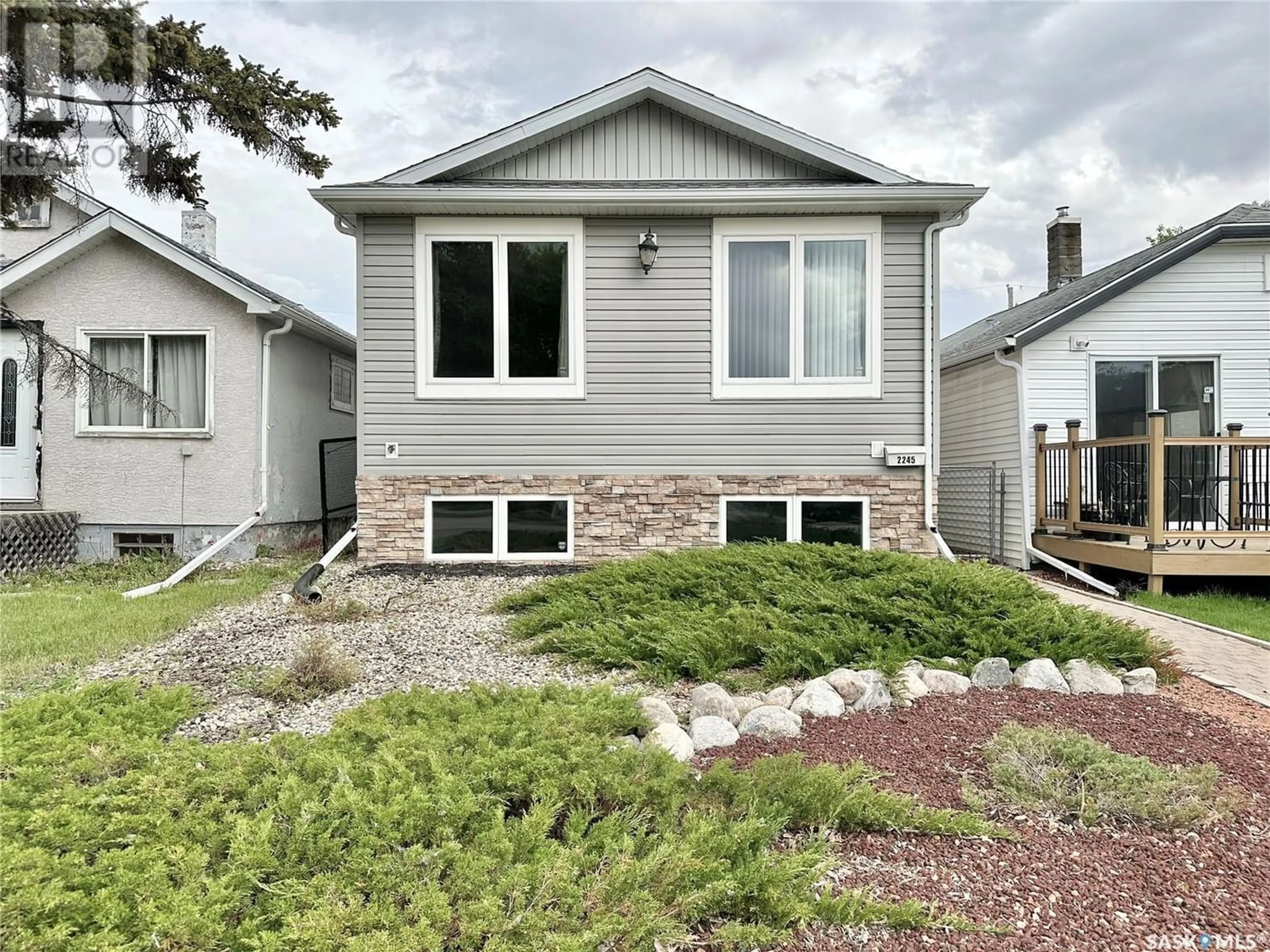Home with vinyl exterior material for 2245 McDonald STREET, Regina Saskatchewan S4N2Y9