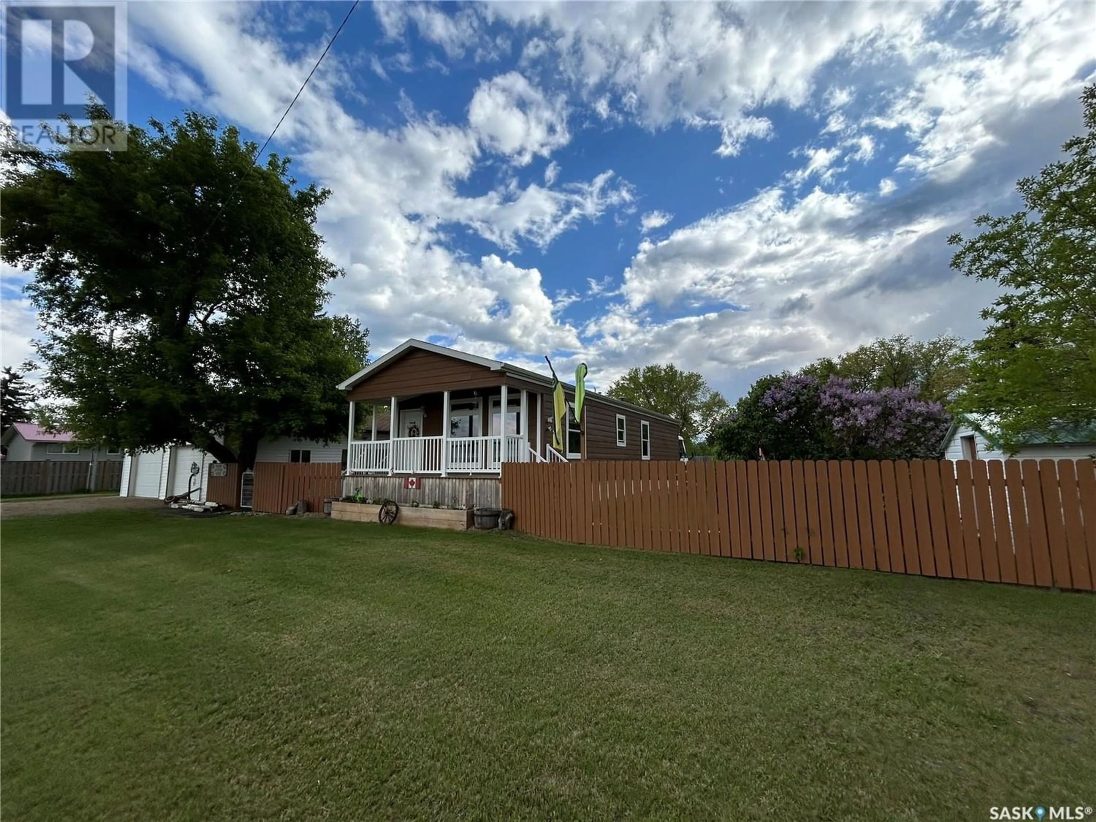 Frontside or backside of a home, the fenced backyard for 4425 Access ROAD, Halbrite Saskatchewan S0C1H0