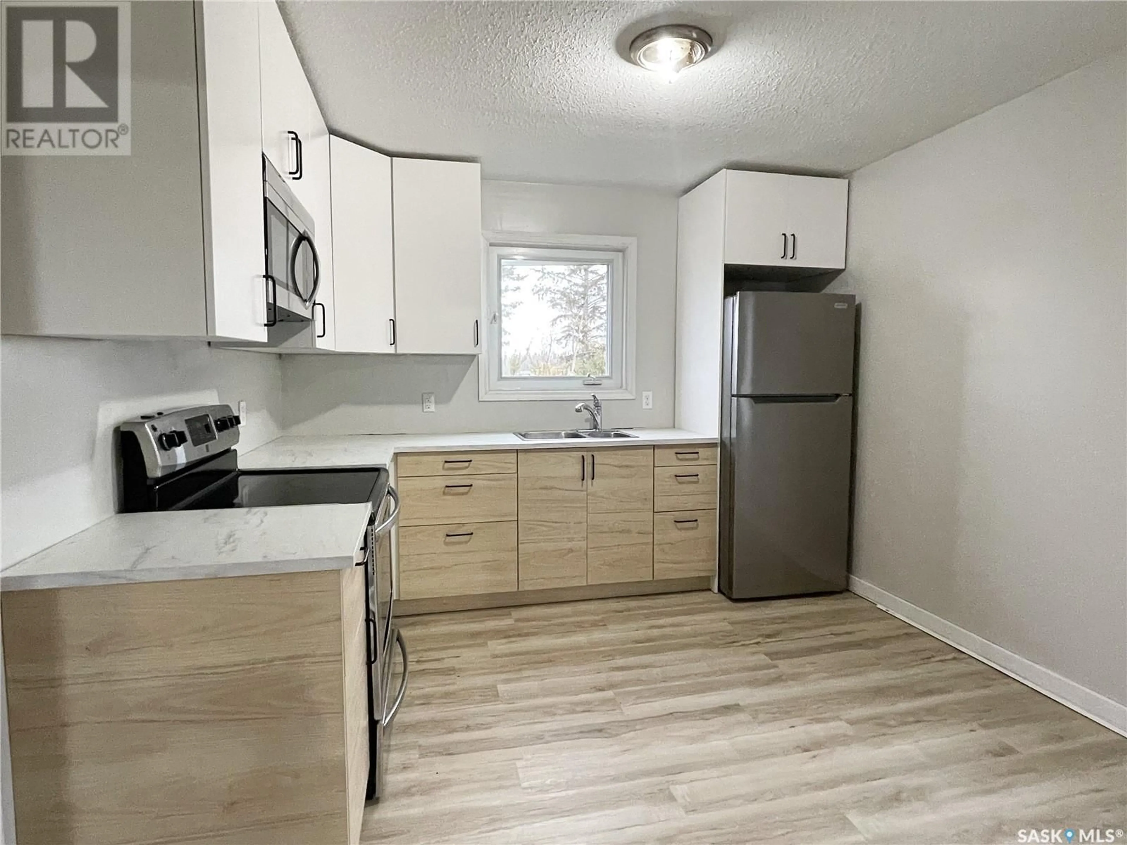 Standard kitchen, wood/laminate floor for 108 MAIN STREET, Dorintosh Saskatchewan S0M0T0