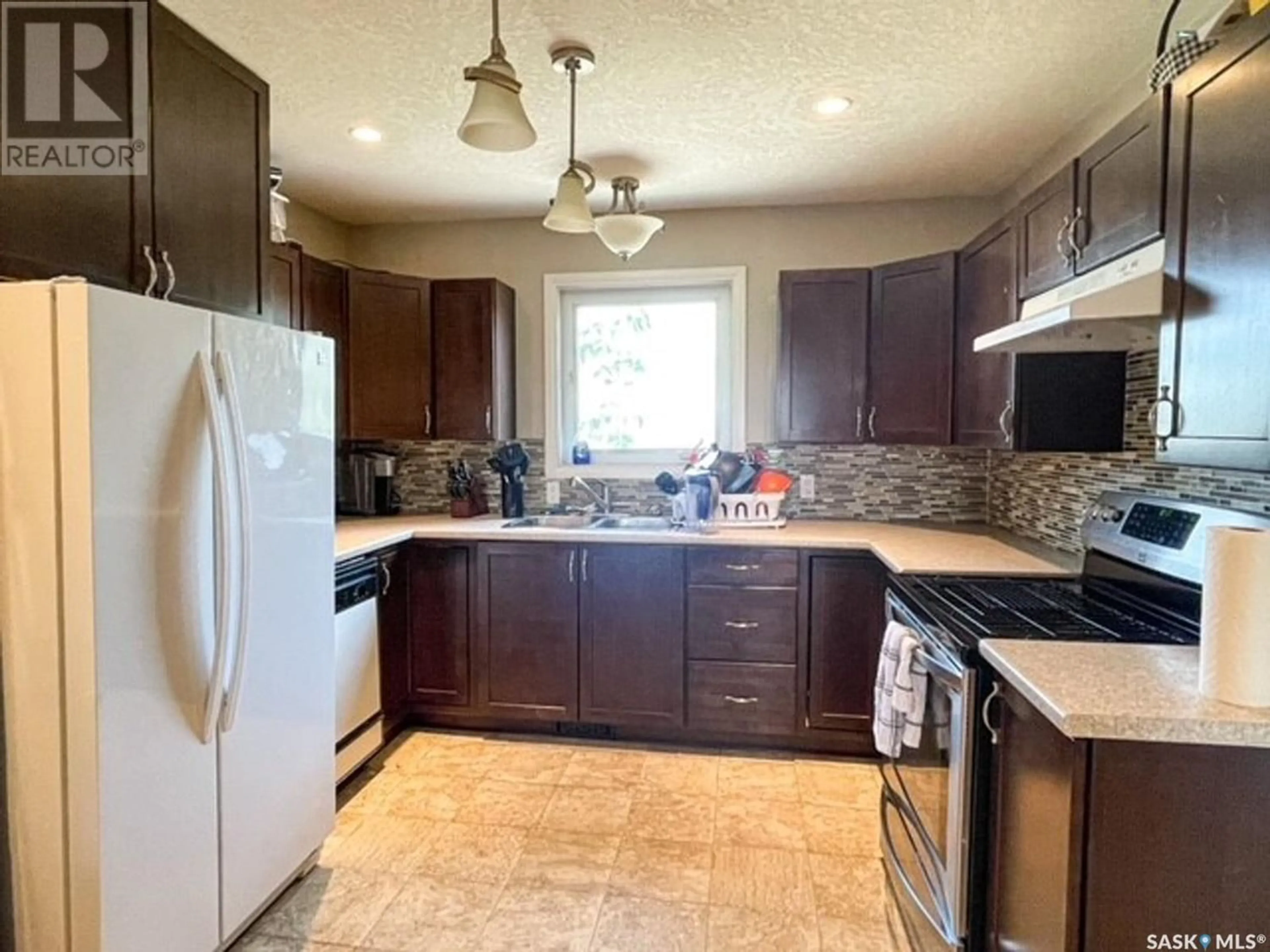 Standard kitchen, wood floors, cottage for 108 Main STREET W, Dorintosh Saskatchewan S0M0T0