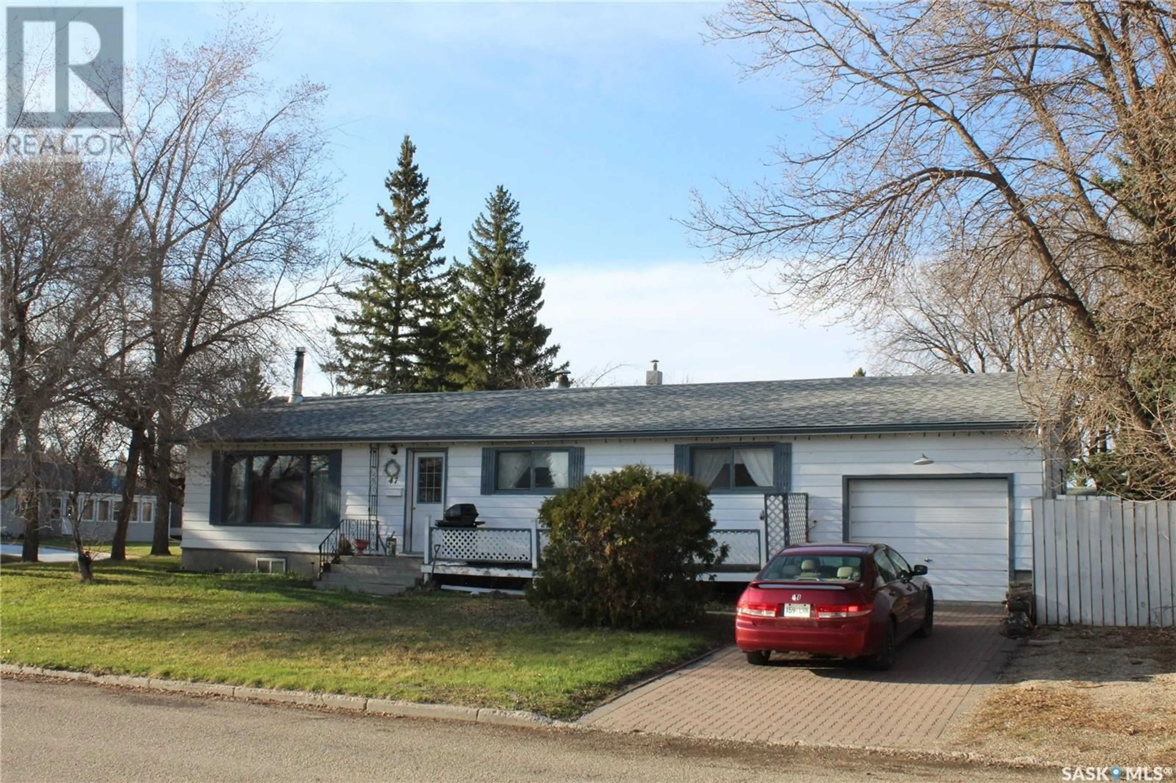 Home with vinyl exterior material, street for 47 BANTRY STREET, Lanigan Saskatchewan S0K2M0