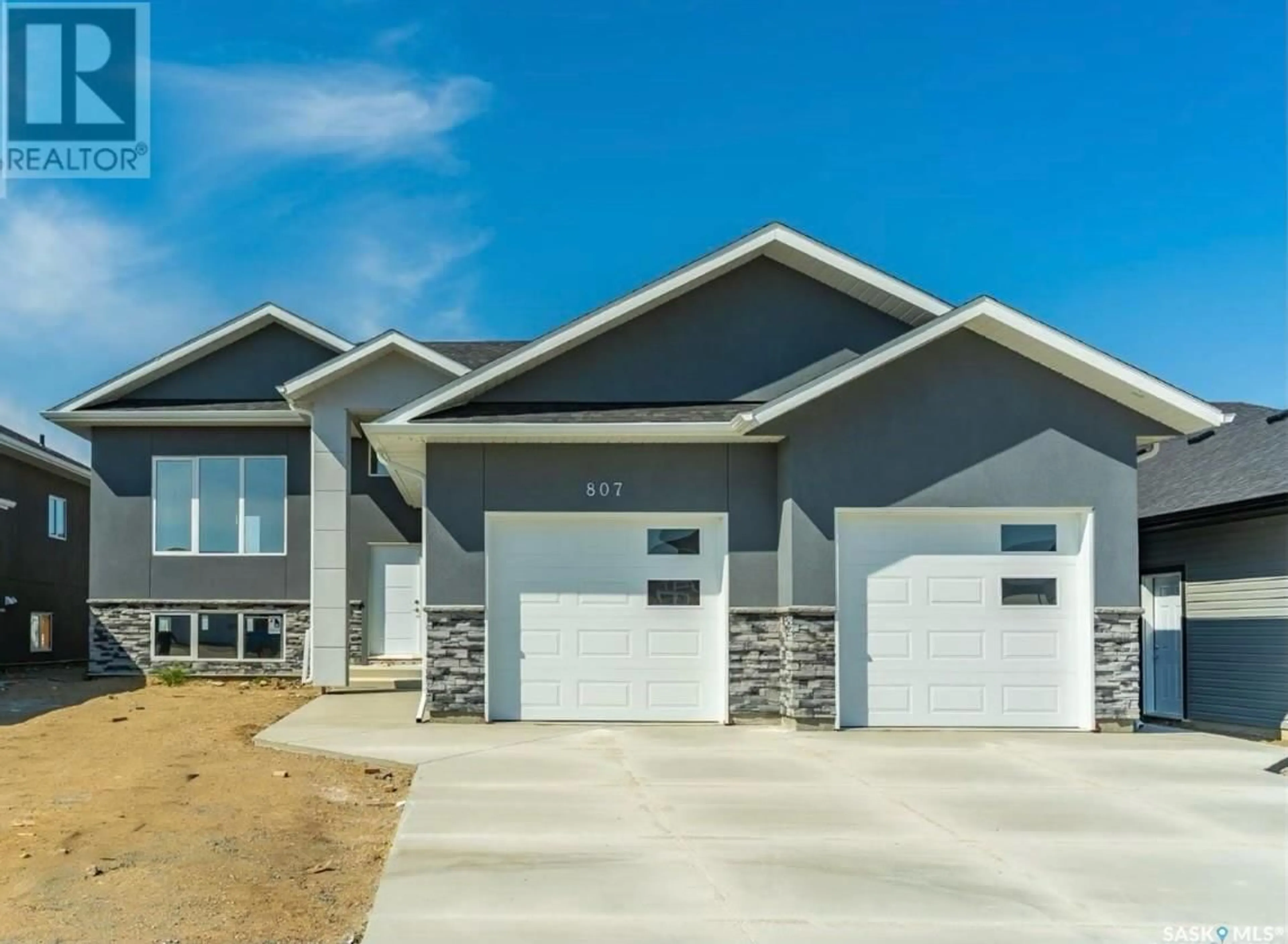 Frontside or backside of a home for 609 Pebble Beach BOULEVARD, Warman Saskatchewan S0K4S4