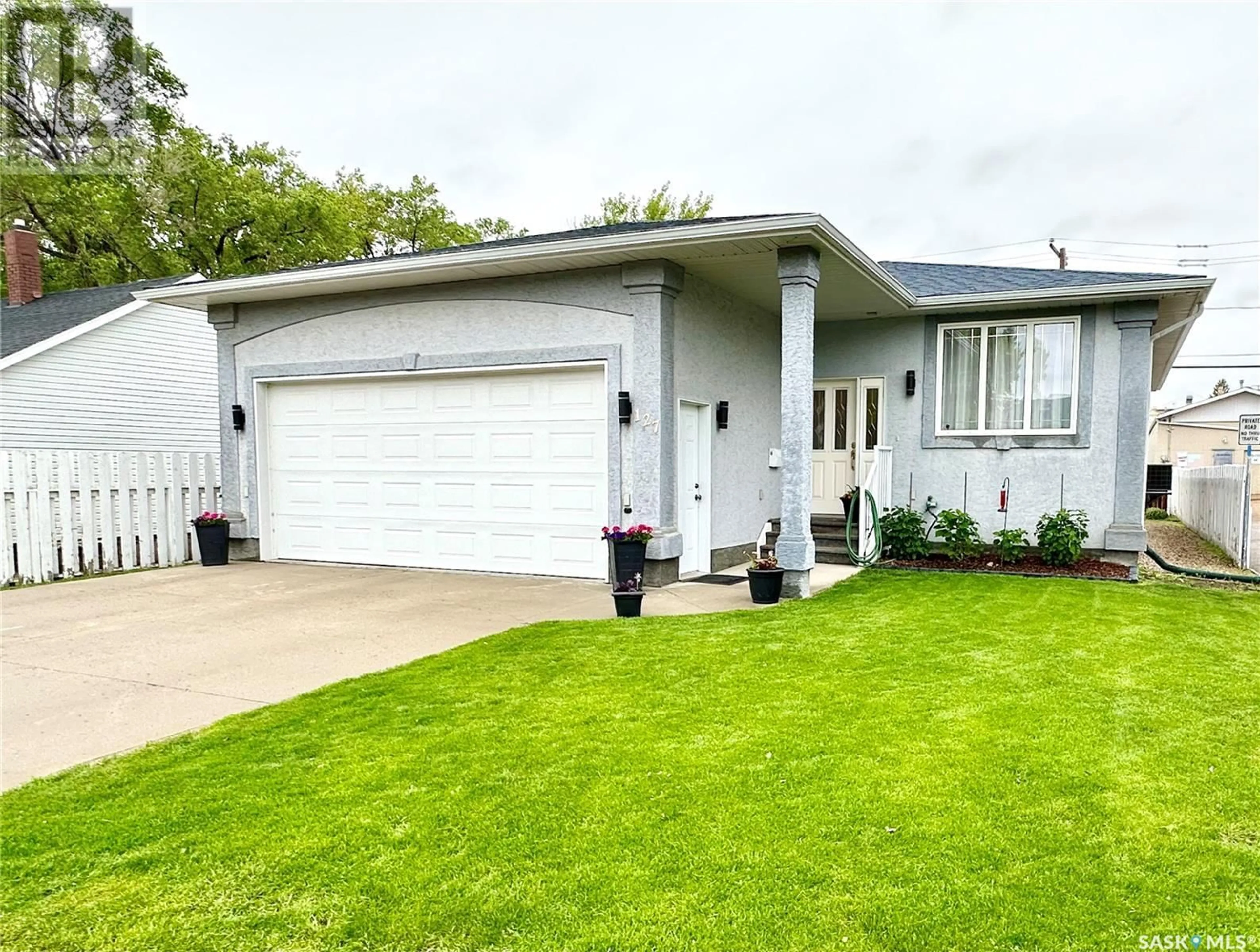 Frontside or backside of a home for 127 5th STREET NE, Weyburn Saskatchewan S4H0Z2