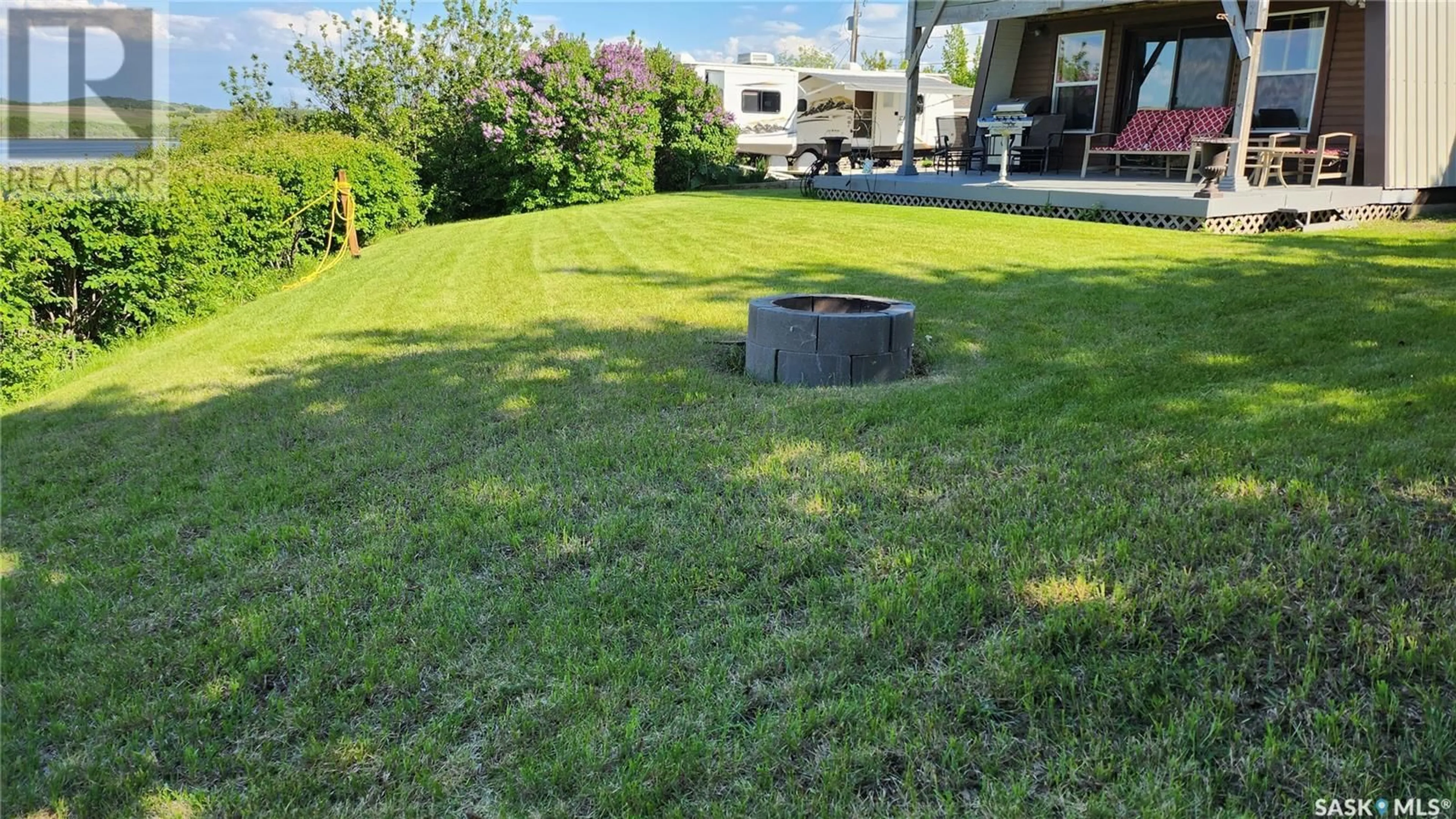 Patio, the fenced backyard for 11 Sleepy Hollow ROAD, Murray Lake Saskatchewan S0M0L0