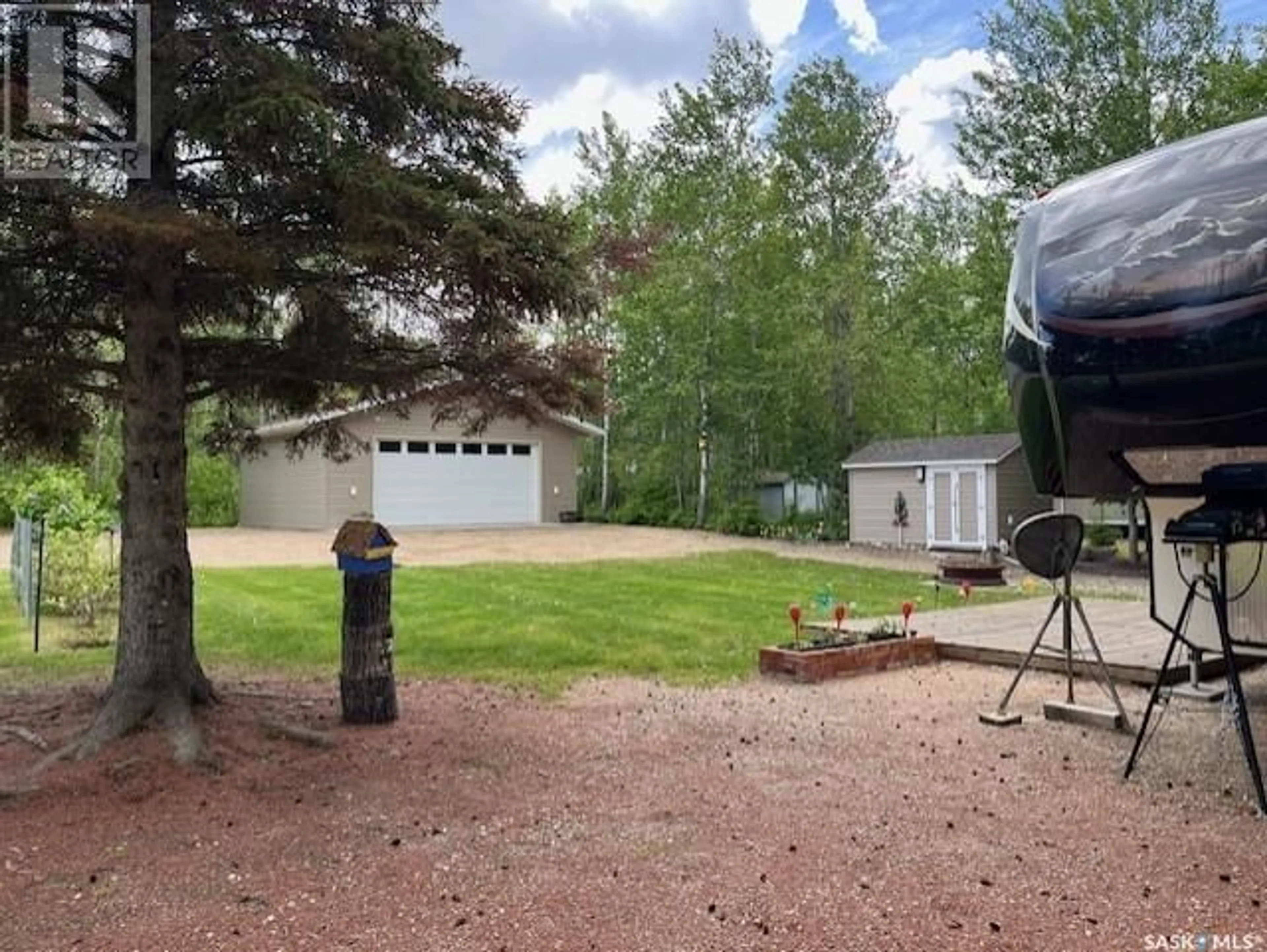 A pic from outside/outdoor area/front of a property/back of a property/a pic from drone, forest/trees view for 1622 WAWASKASIW LANE, Turtle Lake Saskatchewan S0M1J0