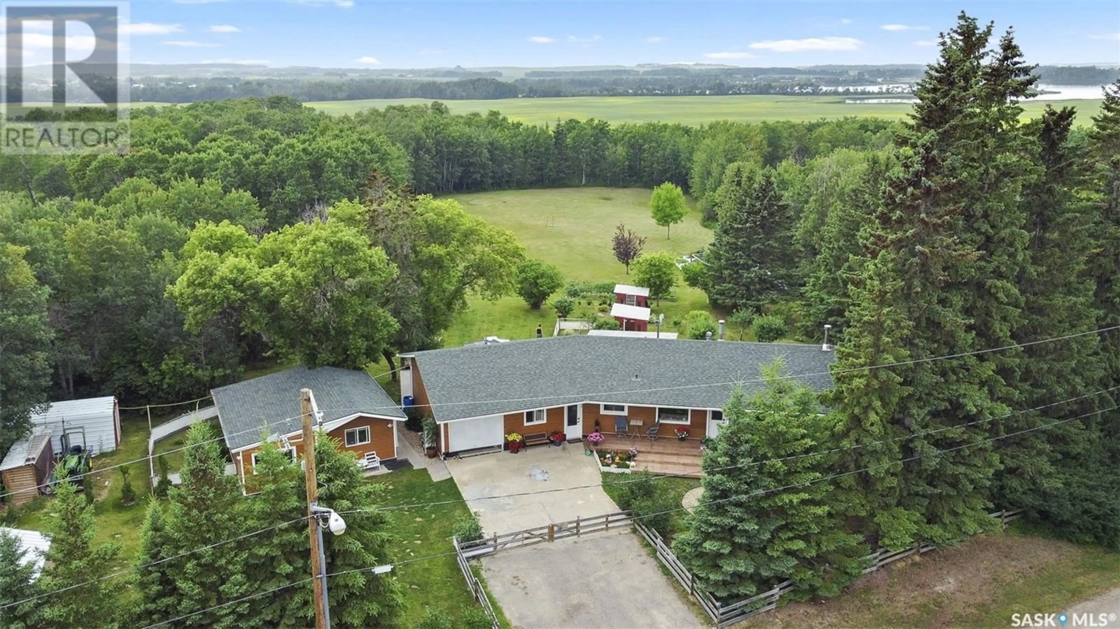 A pic from outside/outdoor area/front of a property/back of a property/a pic from drone, mountain view for 311 Railway AVENUE, Middle Lake Saskatchewan S0K2X0