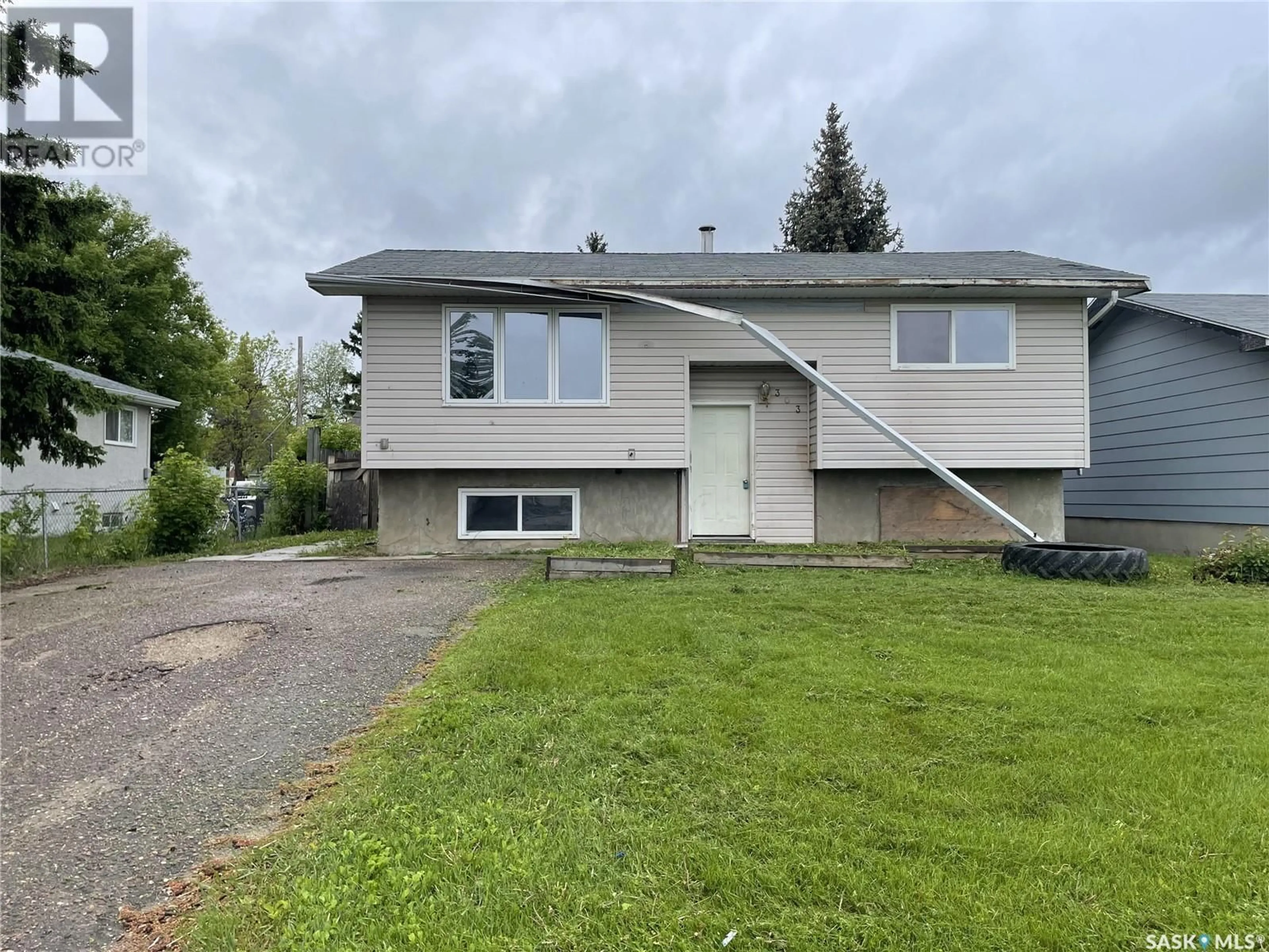 Frontside or backside of a home for 303 8th AVENUE E, Meadow Lake Saskatchewan S9X1G9
