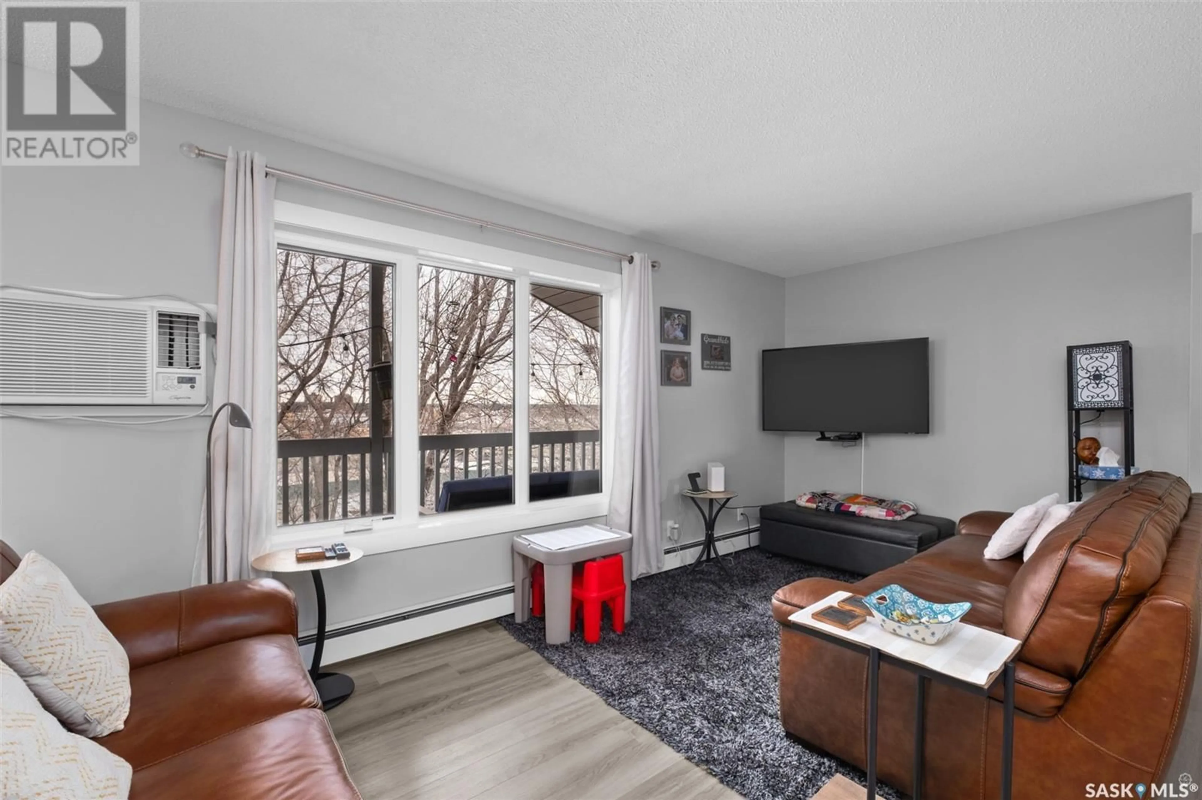 Living room with furniture, wood/laminate floor for W - 6 20 18TH STREET, Prince Albert Saskatchewan S6V3Z7