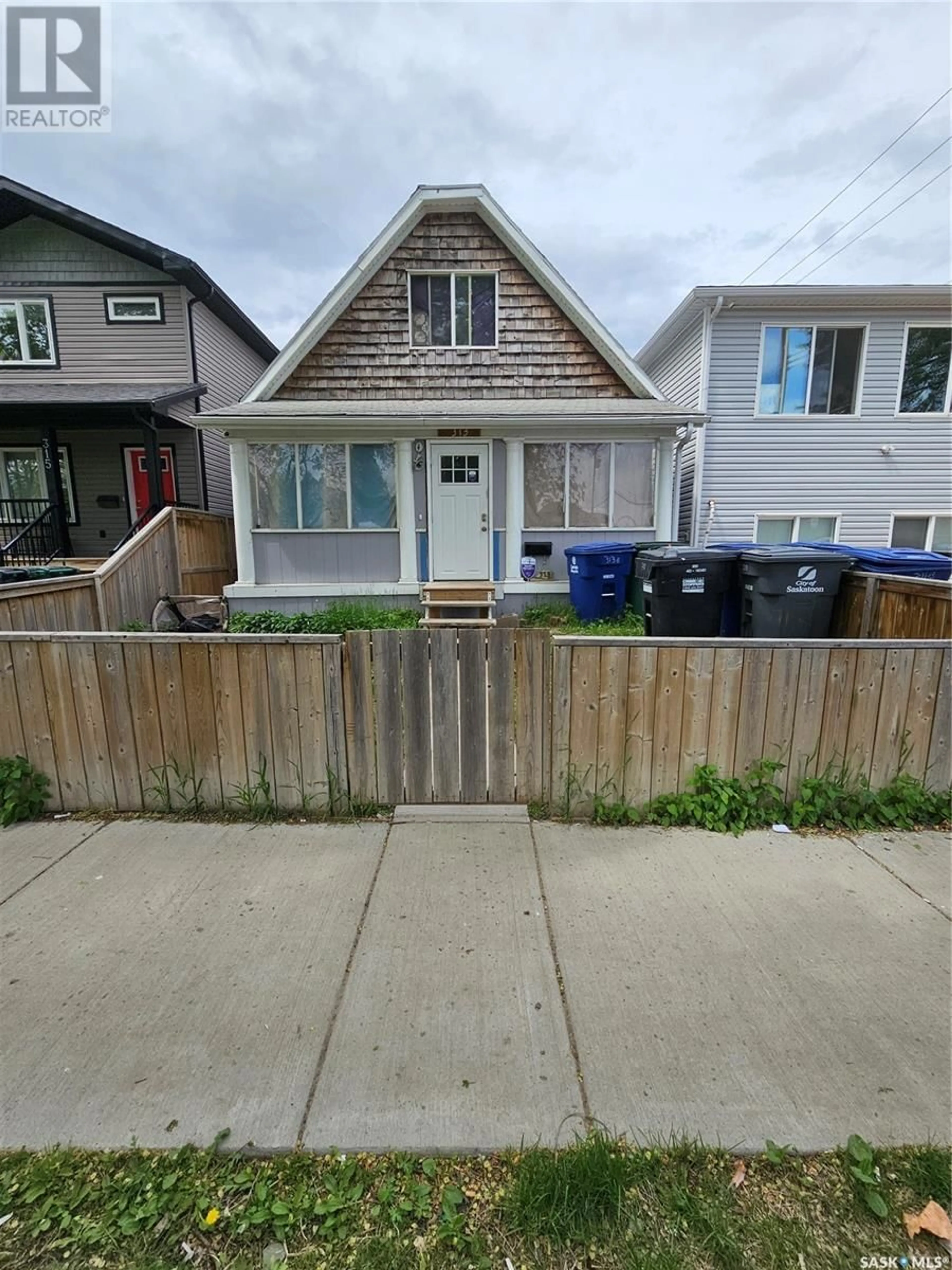Frontside or backside of a home for 313 G AVENUE S, Saskatoon Saskatchewan S7M1V2