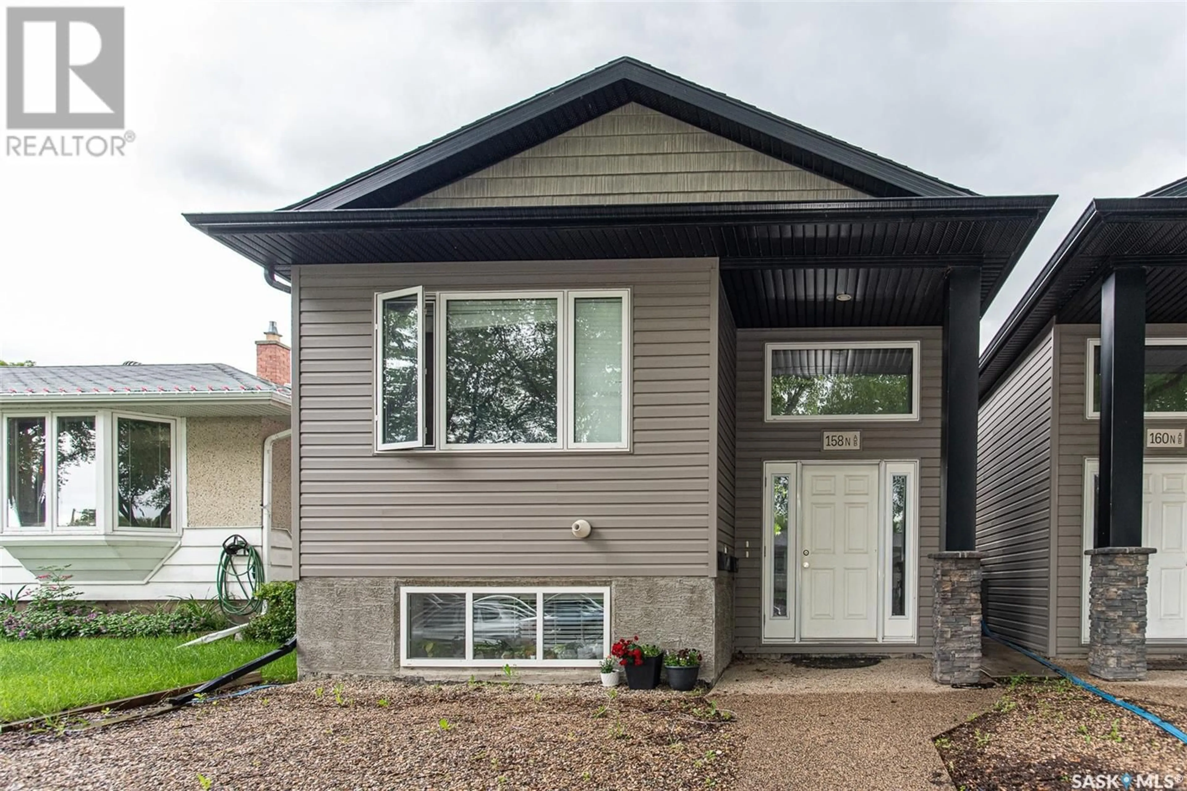 Home with vinyl exterior material for A & B 158 Toronto STREET N, Regina Saskatchewan S4R2T3