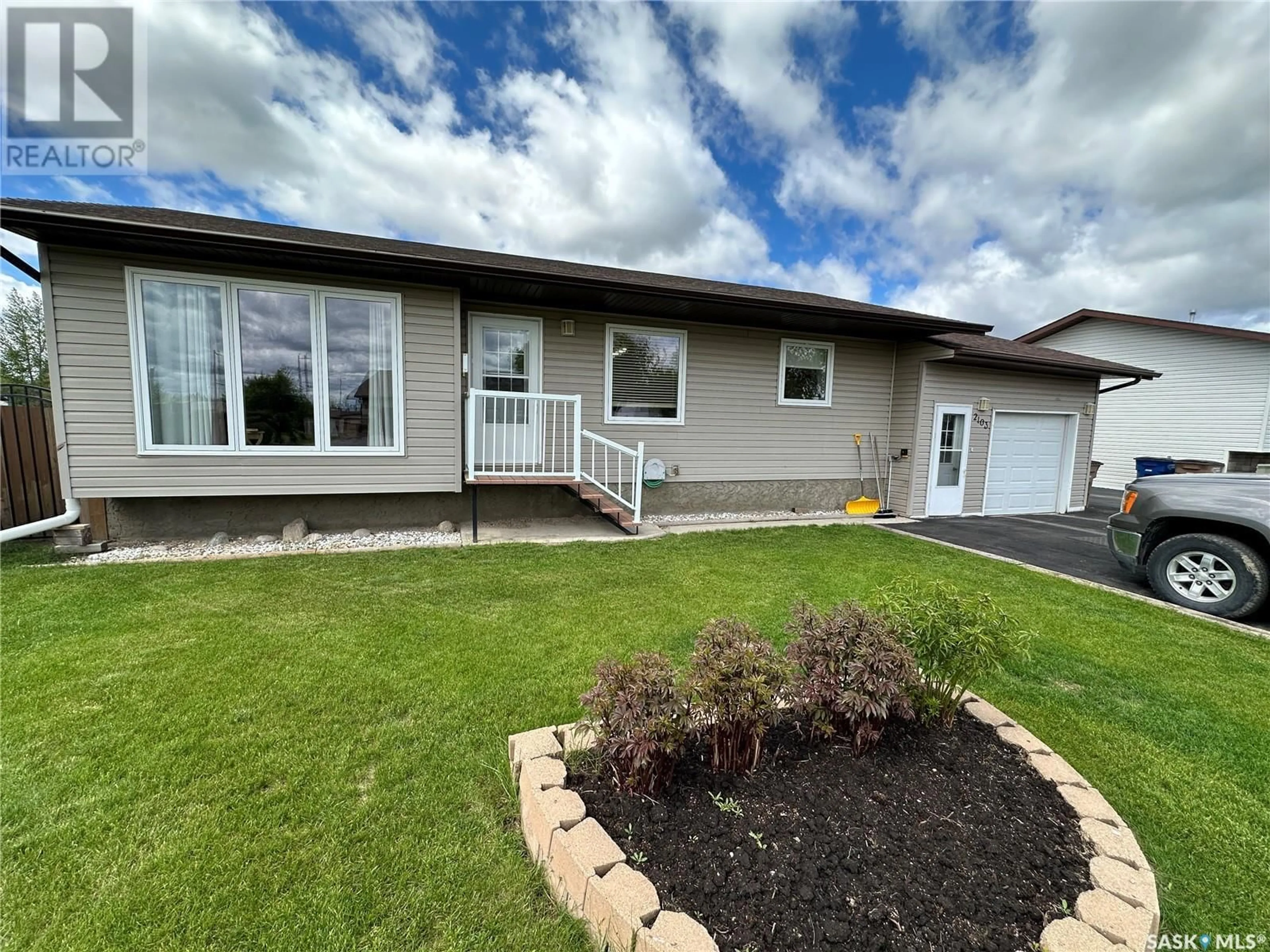 Frontside or backside of a home for 2103 100A STREET, Tisdale Saskatchewan S0E1T0