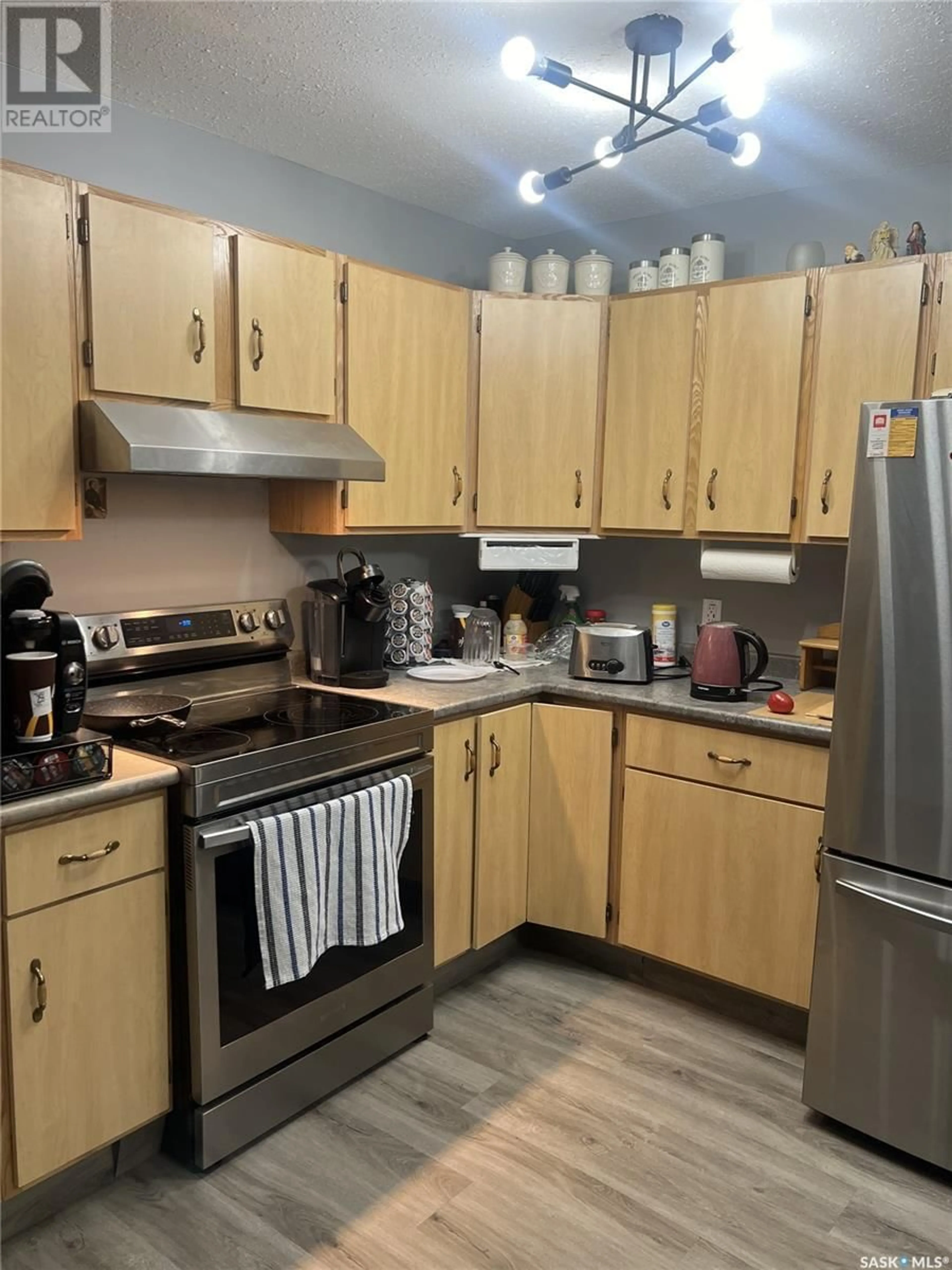 Standard kitchen, wood/laminate floor for 153 2ND AVENUE, Lac La Plonge Saskatchewan S0M0G0