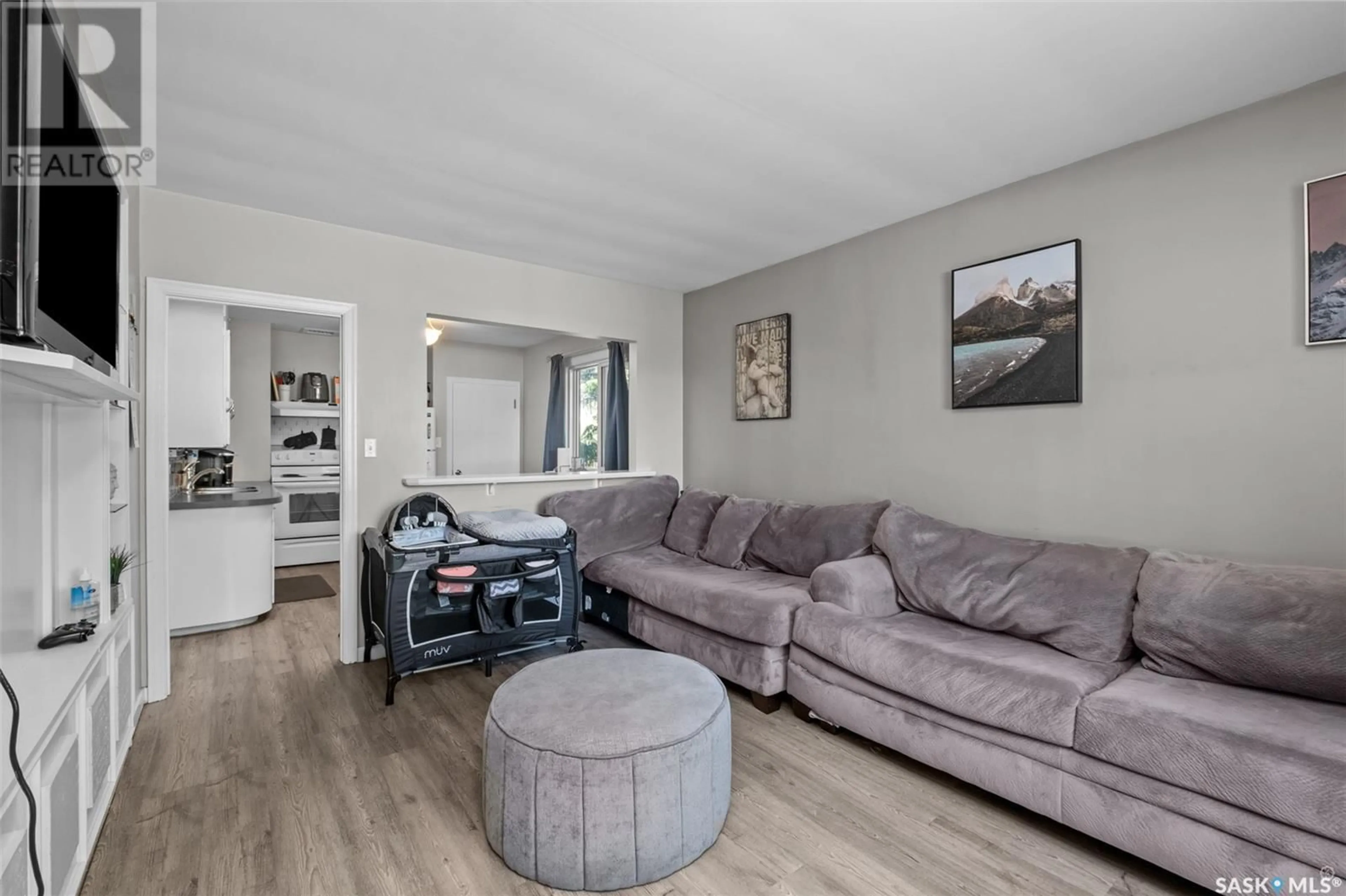 Living room with furniture, wood/laminate floor for 575 12TH STREET, Prince Albert Saskatchewan S6V1C5