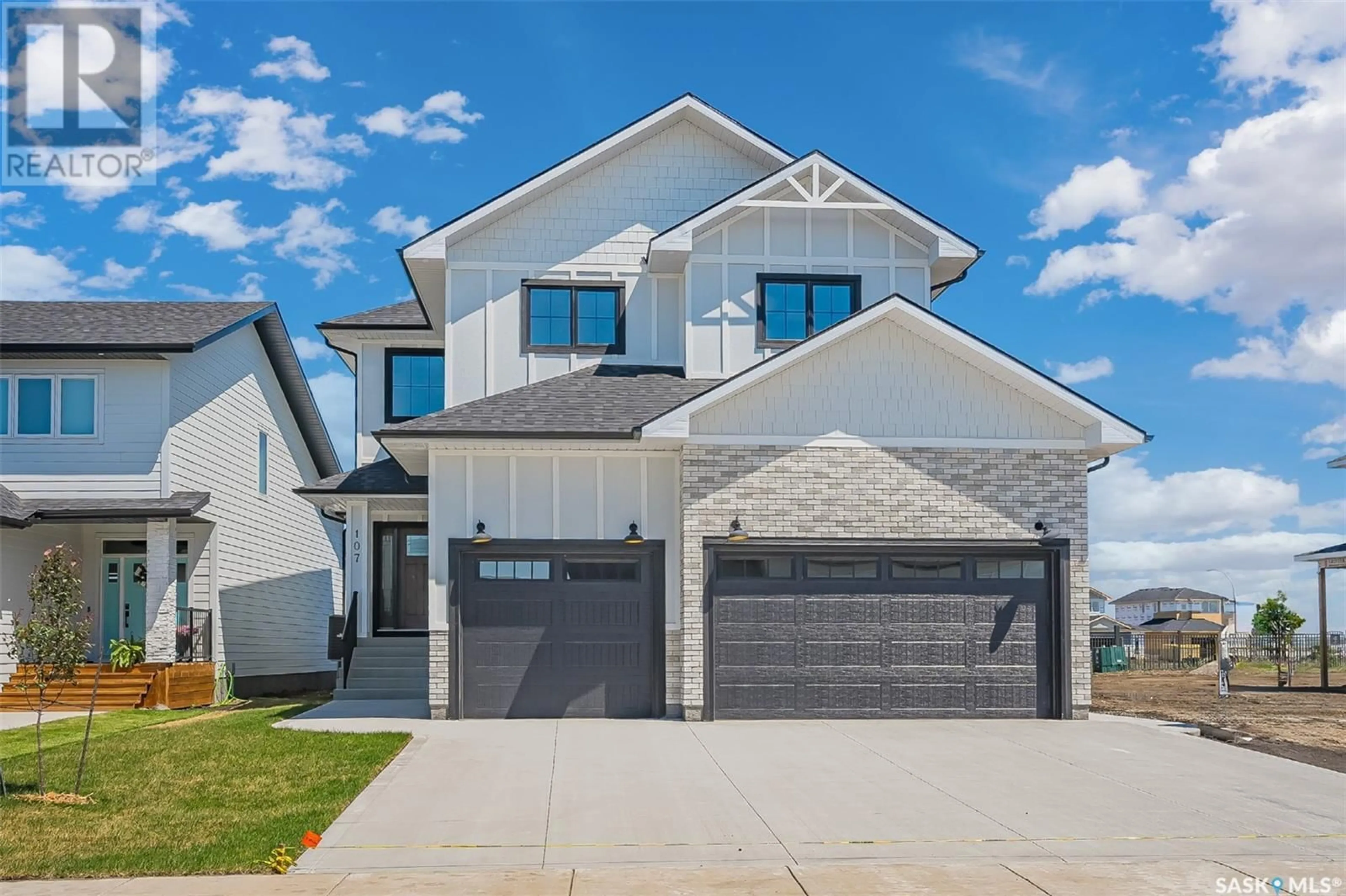 Frontside or backside of a home for 107 Woolf BEND, Saskatoon Saskatchewan S7W0Z6