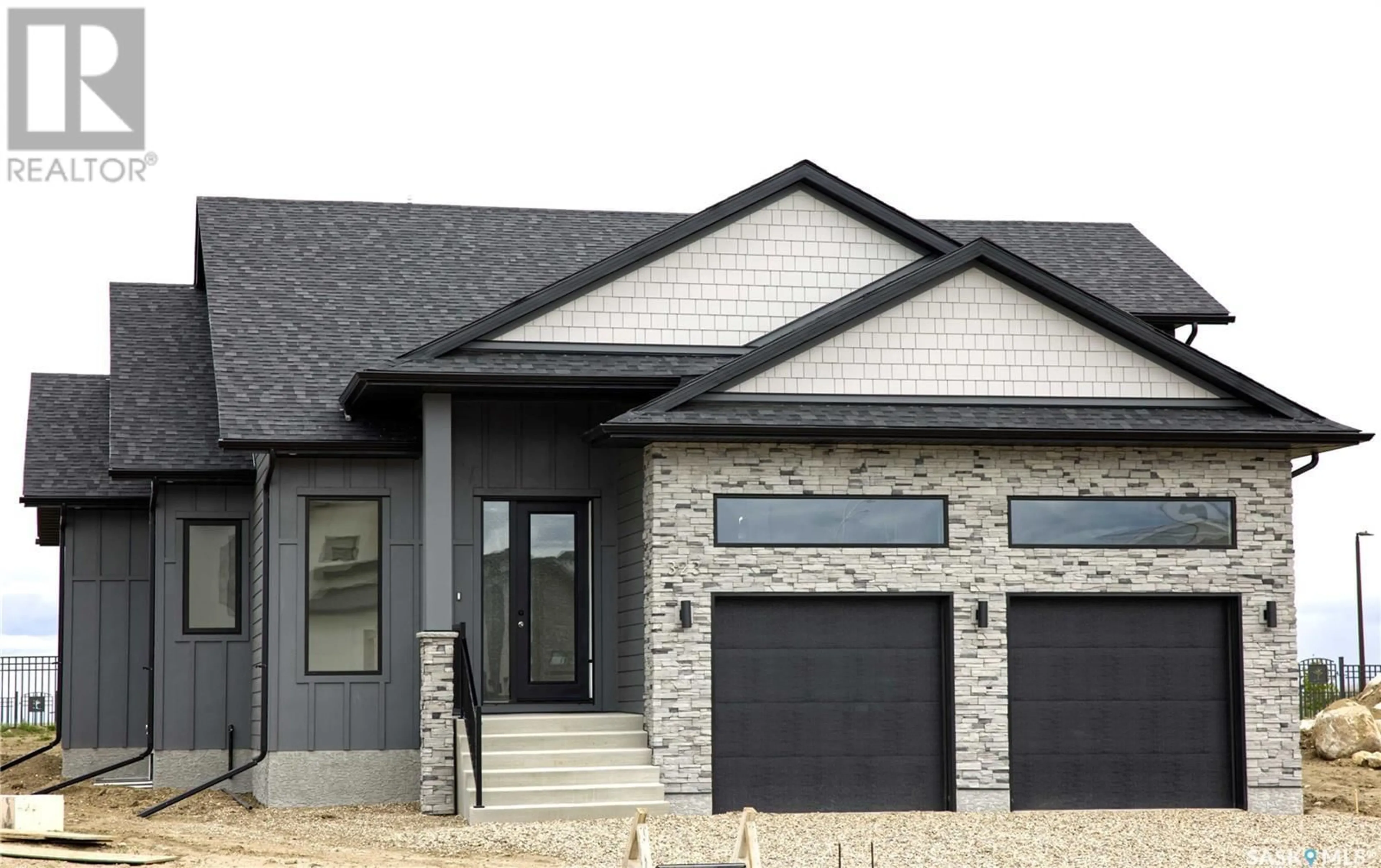 Home with brick exterior material for 323 Woolf BAY, Saskatoon Saskatchewan S7W1E5