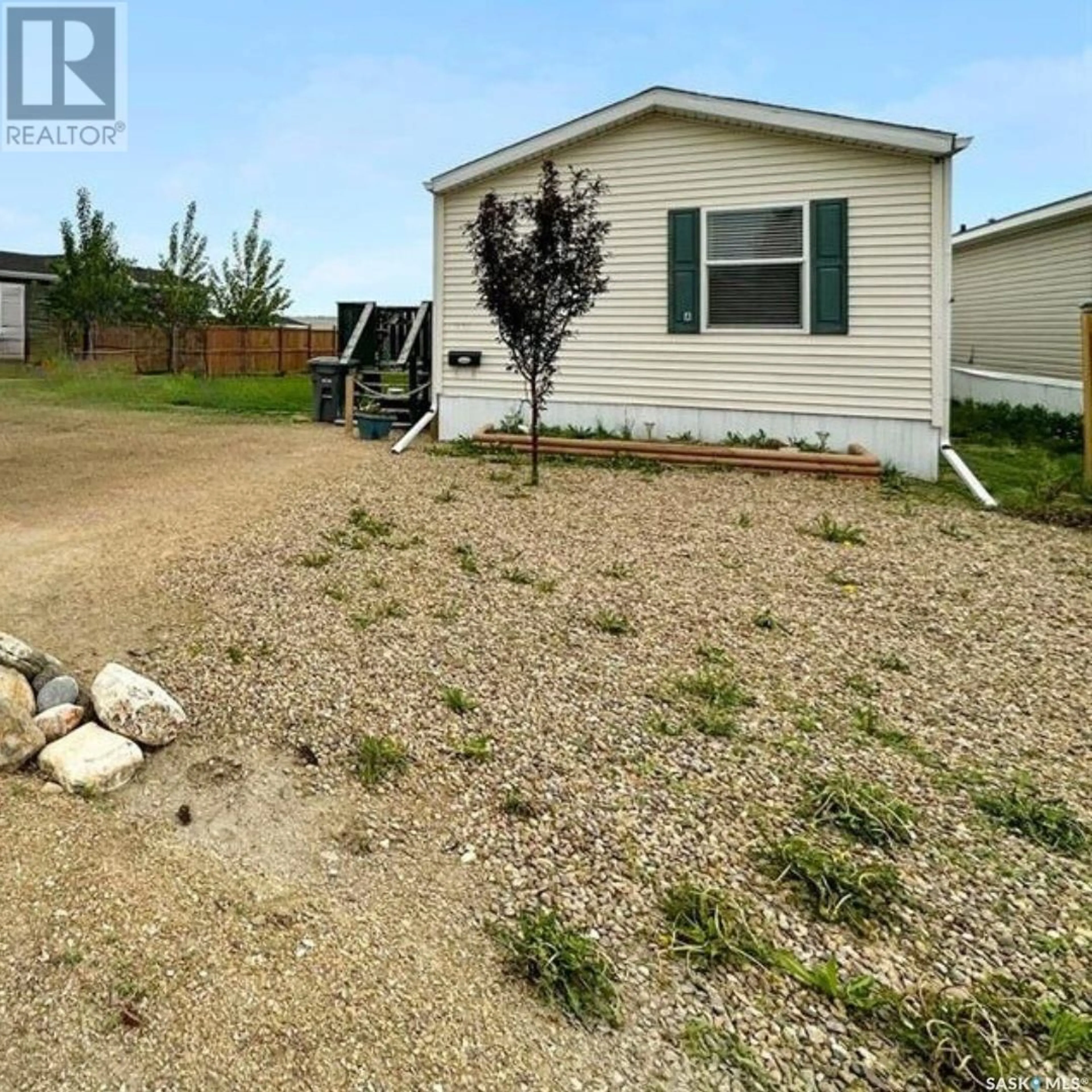 Frontside or backside of a home, the fenced backyard for 73A Prairie Sun COURT, Swift Current Saskatchewan S9H3X6