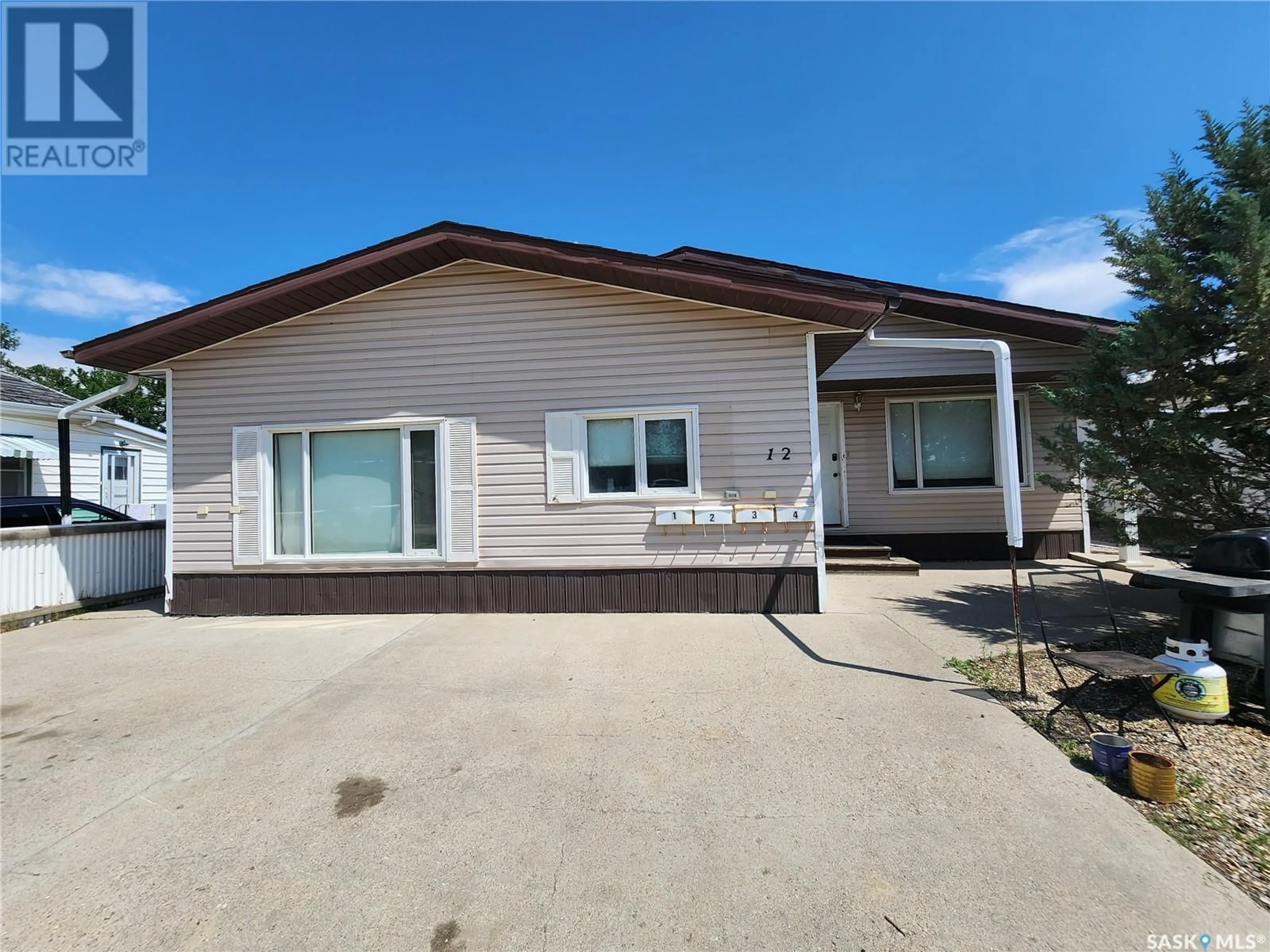 A pic from exterior of the house or condo for 12 8th STREET NE, Weyburn Saskatchewan S4H1C7