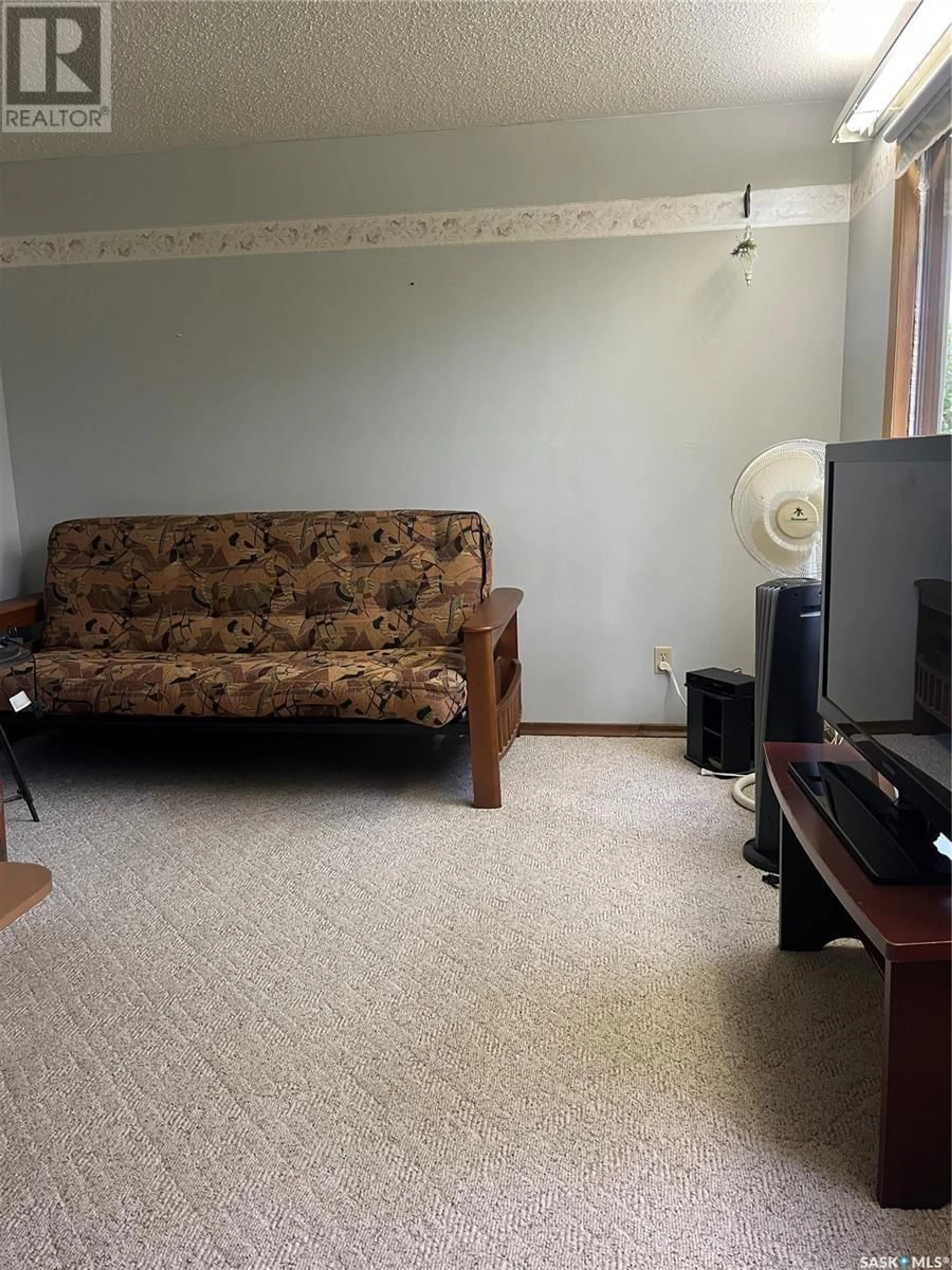 Living room with furniture, unknown for 1130 Franklin AVENUE, Esterhazy Saskatchewan S0A0X0